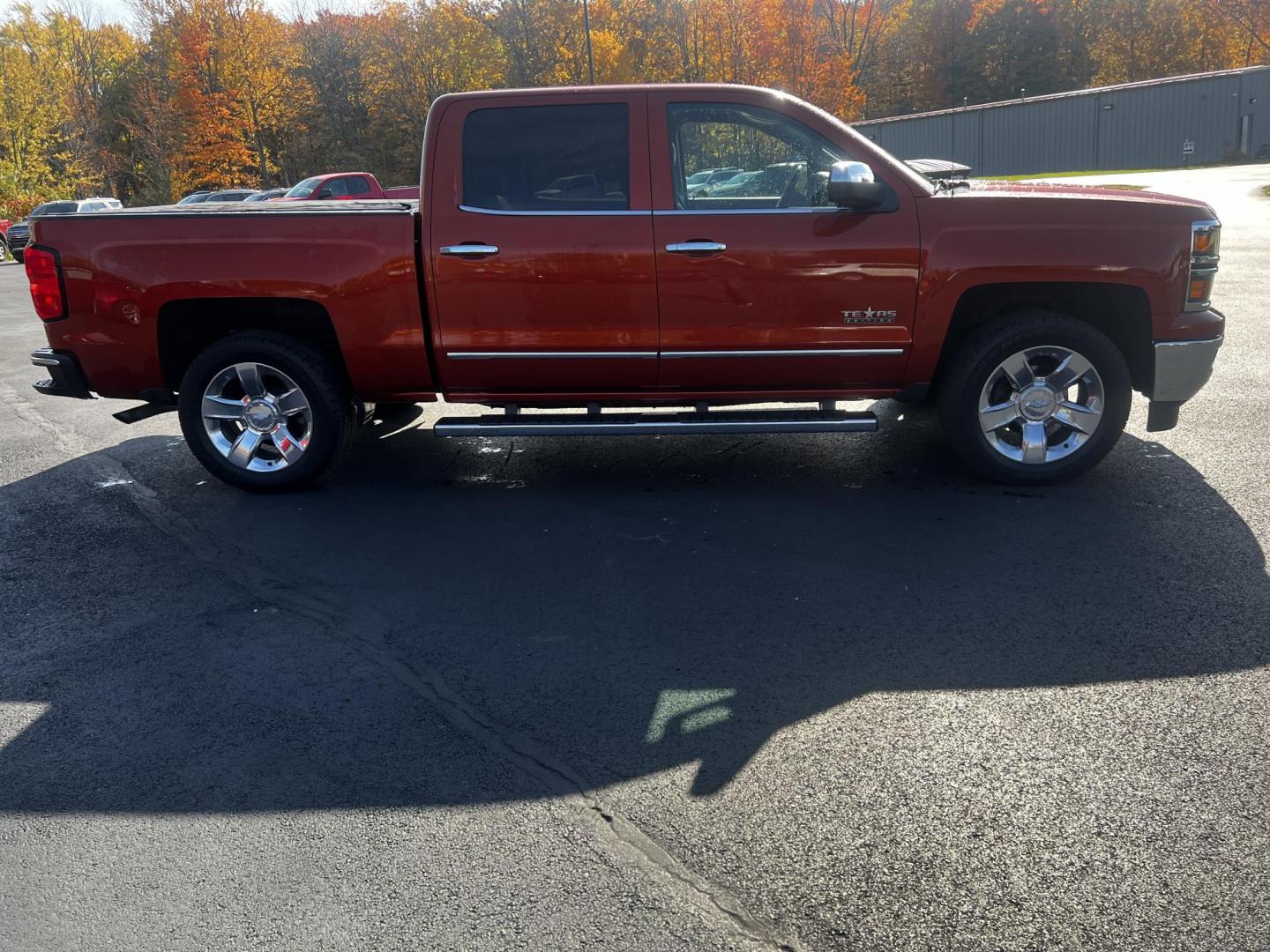 2015 Orange /Black Chevrolet Silverado 1500 LTZ Crew Cab 4WD (3GCUKSEC8FG) with an 5.3L V8 OHV 16V engine, 6-Speed Automatic transmission, located at 11115 Chardon Rd. , Chardon, OH, 44024, (440) 214-9705, 41.580246, -81.241943 - Photo#7