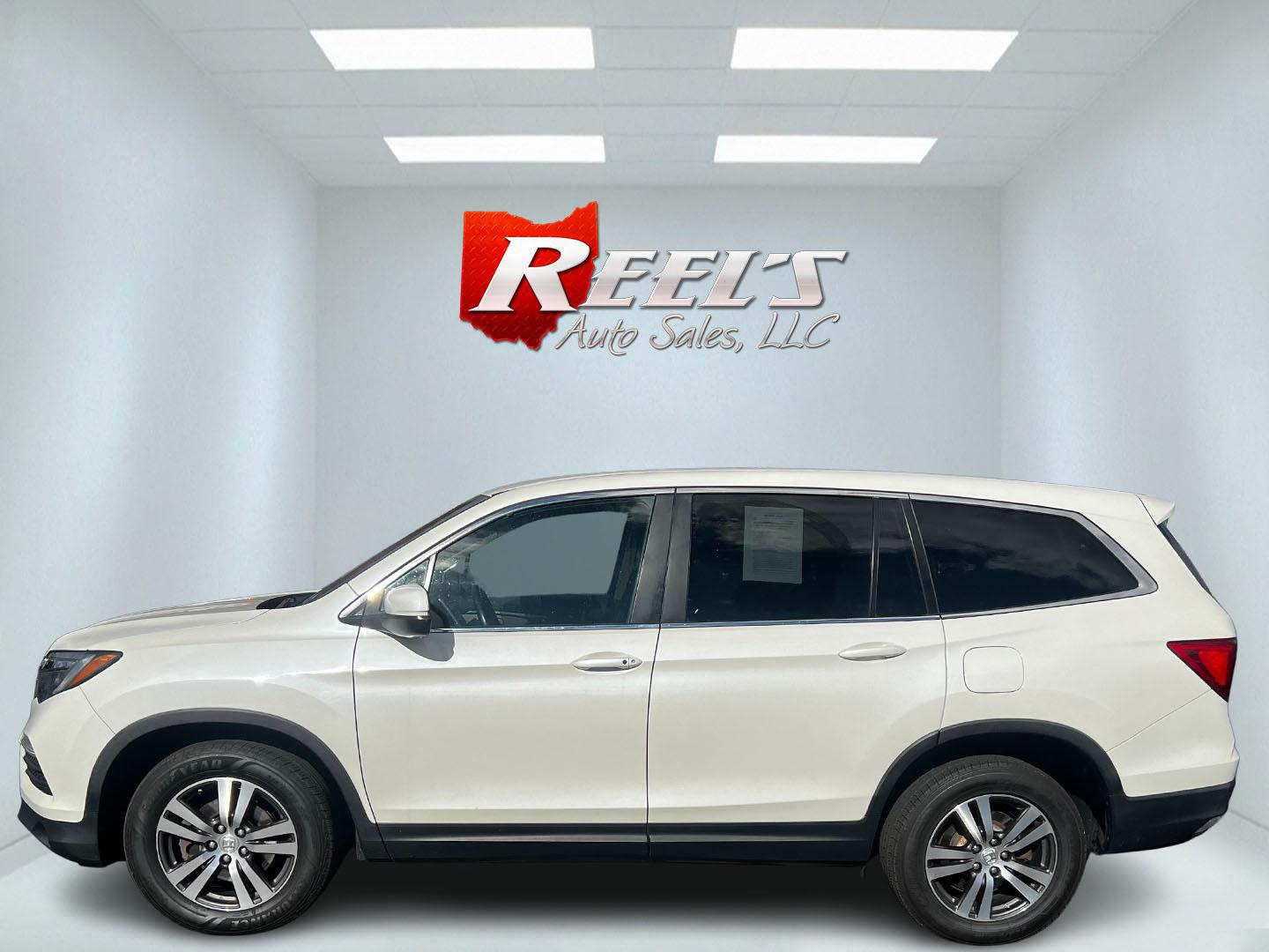 2016 White /Gray Honda Pilot EXL 4WD (5FNYF6H55GB) with an 3.5L V6 SOHC 24V engine, 6-Speed Automatic transmission, located at 11115 Chardon Rd. , Chardon, OH, 44024, (440) 214-9705, 41.580246, -81.241943 - This 2016 Honda Pilot EX-L AWD, equipped with a 3.5L EarthDreams V6 engine and a 6-speed automatic transmission, offers a blend of performance and efficiency, achieving approximately 26 MPG on the highway. It features a comfortable leather interior with heated front seats, an 8.0" touchscreen, and H - Photo#9