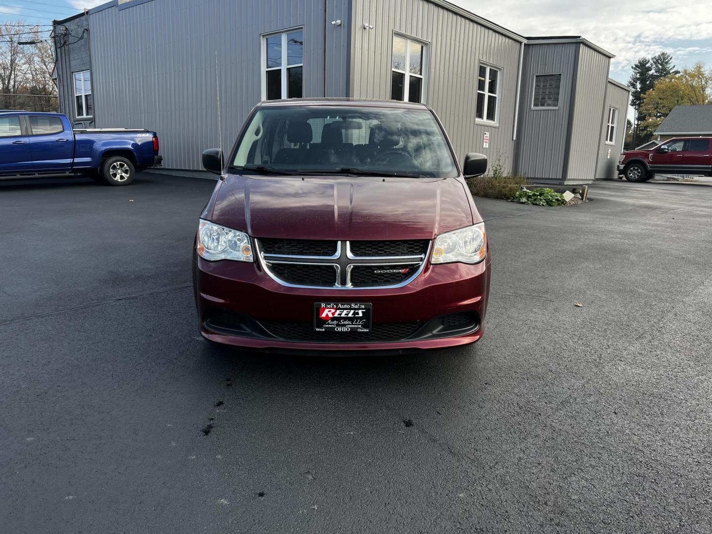 2016 Red /Black Dodge Grand Caravan SE (2C4RDGBG1GR) with an 3.6L V6 DOHC 24V FFV engine, 6A transmission, located at 11115 Chardon Rd. , Chardon, OH, 44024, (440) 214-9705, 41.580246, -81.241943 - Photo#1