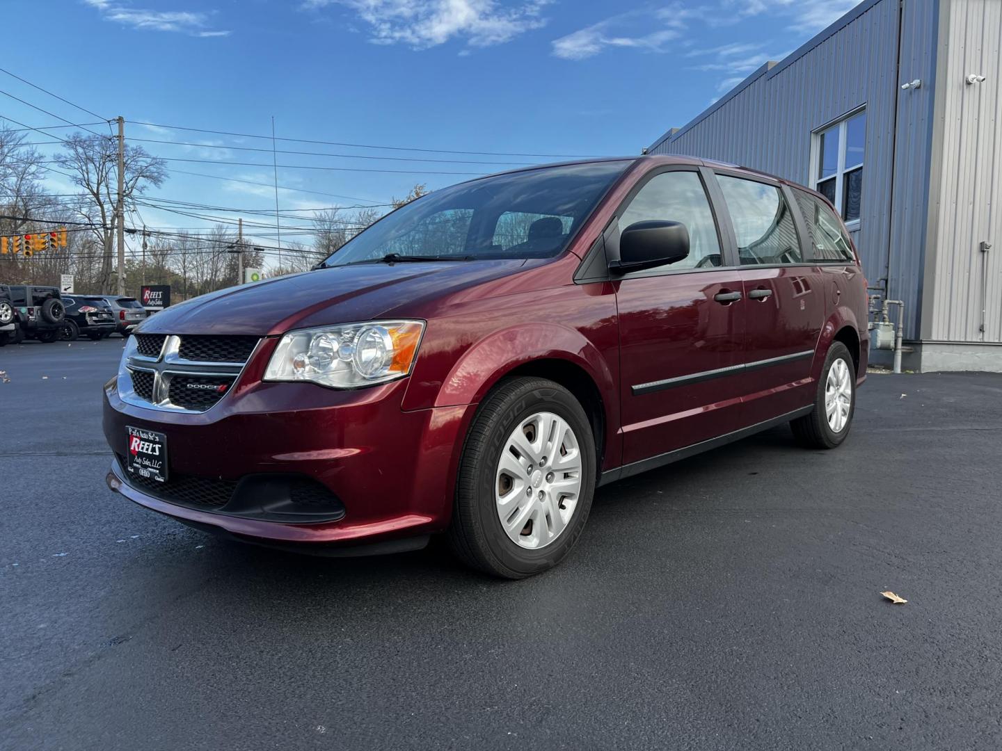 2016 Red /Black Dodge Grand Caravan SE (2C4RDGBG1GR) with an 3.6L V6 DOHC 24V FFV engine, 6A transmission, located at 11115 Chardon Rd. , Chardon, OH, 44024, (440) 214-9705, 41.580246, -81.241943 - Photo#0