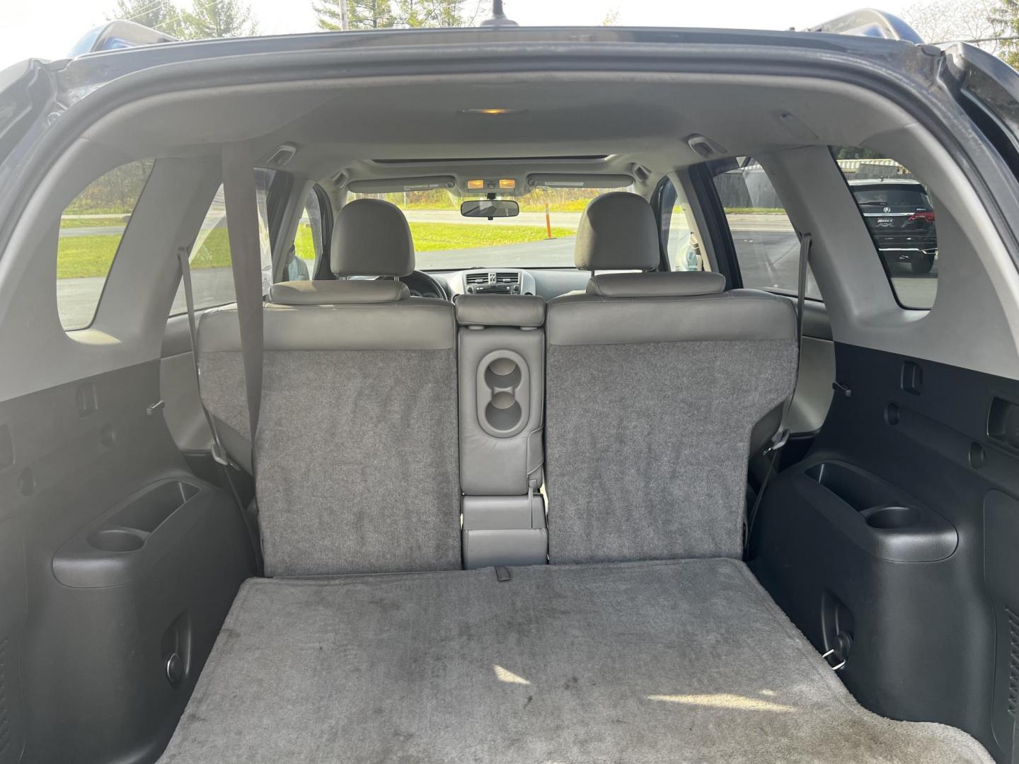 2010 Black /Gray Toyota RAV4 Limited I4 4WD (JTMDF4DV6AD) with an 2.4L I4 DOHC 16V engine, 4-Speed Automatic transmission, located at 11115 Chardon Rd. , Chardon, OH, 44024, (440) 214-9705, 41.580246, -81.241943 - This 2010 Toyota RAV4 Limited 4WD is a versatile and comfortable SUV that caters to both practicality and driver comfort. It is equipped with a 2.4-liter inline-4 engine, paired with a 4-speed automatic transmission, offering reliable performance for everyday driving. The vehicle features functional - Photo#36