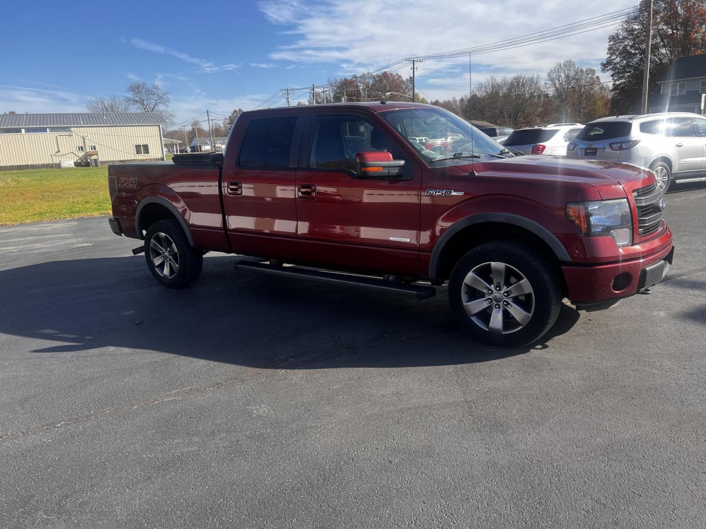 2014 Orange /Black Ford F-150 FX4 SuperCrew 6.5-ft. Bed 4WD (1FTFW1ET7EK) with an 3.5L V6 DOHC 24V TWIN TURBO engine, 6-Speed Automatic transmission, located at 547 E. Main St., Orwell, OH, 44076, (440) 437-5893, 41.535435, -80.847855 - Photo#3