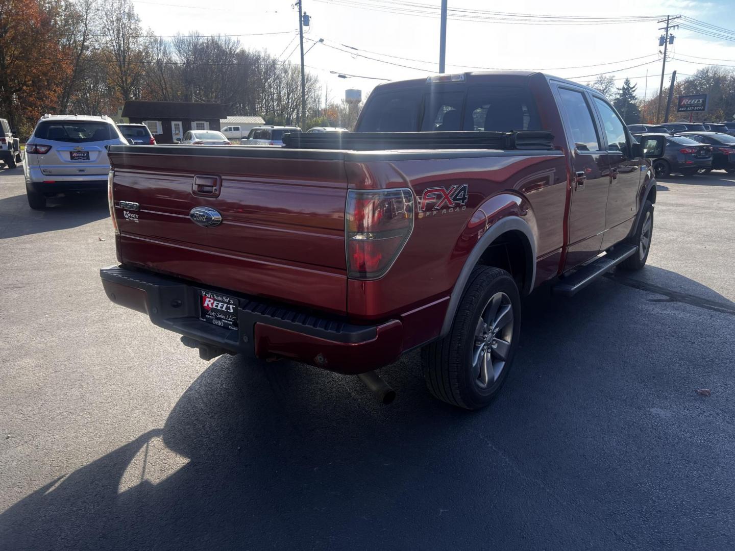 2014 Orange /Black Ford F-150 FX4 SuperCrew 6.5-ft. Bed 4WD (1FTFW1ET7EK) with an 3.5L V6 DOHC 24V TWIN TURBO engine, 6-Speed Automatic transmission, located at 547 E. Main St., Orwell, OH, 44076, (440) 437-5893, 41.535435, -80.847855 - Photo#9