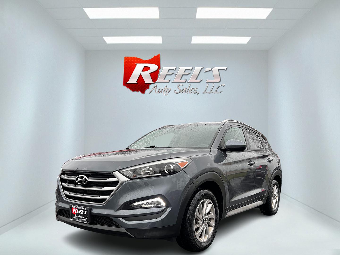 2017 Gray /Black Hyundai Tucson SE w/Popular Package AWD (KM8J3CA43HU) with an 2.0L I4 DOHC 16V engine, 6 Speed Auto transmission, located at 547 E. Main St., Orwell, OH, 44076, (440) 437-5893, 41.535435, -80.847855 - Photo#0