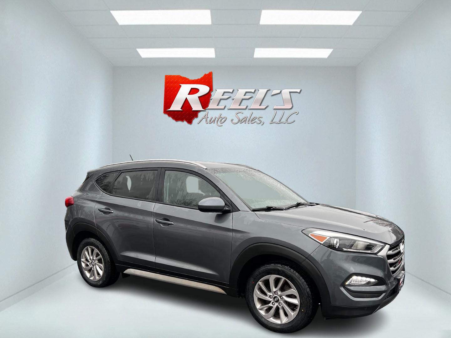 2017 Gray /Black Hyundai Tucson SE w/Popular Package AWD (KM8J3CA43HU) with an 2.0L I4 DOHC 16V engine, 6 Speed Auto transmission, located at 547 E. Main St., Orwell, OH, 44076, (440) 437-5893, 41.535435, -80.847855 - Photo#3