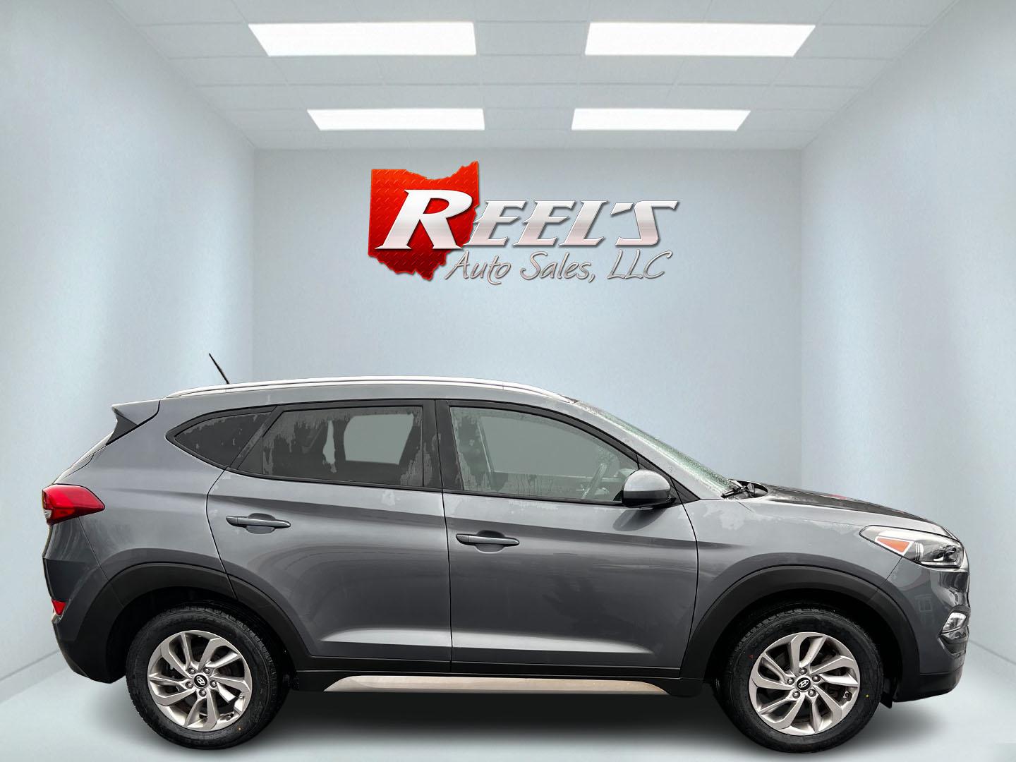 2017 Gray /Black Hyundai Tucson SE w/Popular Package AWD (KM8J3CA43HU) with an 2.0L I4 DOHC 16V engine, 6 Speed Auto transmission, located at 547 E. Main St., Orwell, OH, 44076, (440) 437-5893, 41.535435, -80.847855 - Photo#4