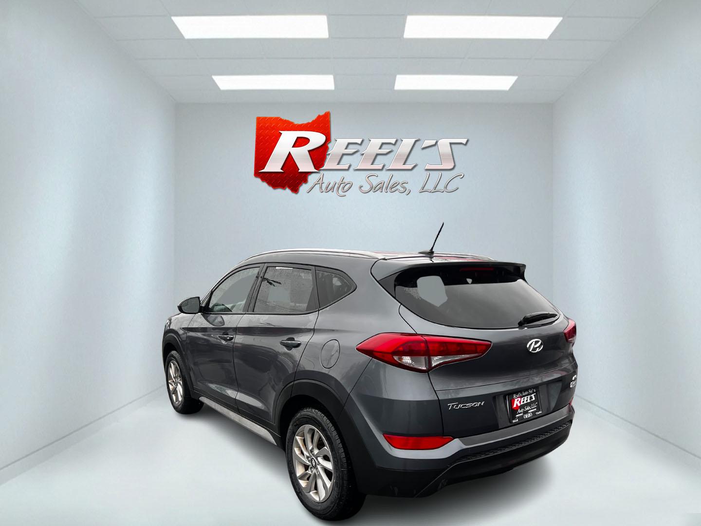 2017 Gray /Black Hyundai Tucson SE w/Popular Package AWD (KM8J3CA43HU) with an 2.0L I4 DOHC 16V engine, 6 Speed Auto transmission, located at 547 E. Main St., Orwell, OH, 44076, (440) 437-5893, 41.535435, -80.847855 - Photo#7