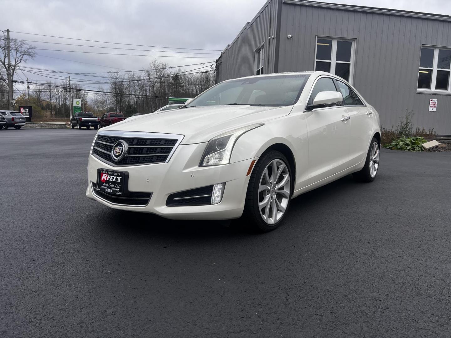 2014 White /Black Cadillac ATS 3.6L Premium AWD (1G6AL5S31E0) with an 3.6L V6 DOHC 24V engine, 6-Speed Automatic transmission, located at 11115 Chardon Rd. , Chardon, OH, 44024, (440) 214-9705, 41.580246, -81.241943 - This 2014 Cadillac ATS Premium V6 AWD is a luxury sedan that combines performance and comfort features. It comes with a robust 3.6-liter V6 engine producing 321 horsepower and is paired with a 6-speed automatic transmission, allowing for a brisk 0-60 mph time of 5.4 seconds. The interior is well-app - Photo#0