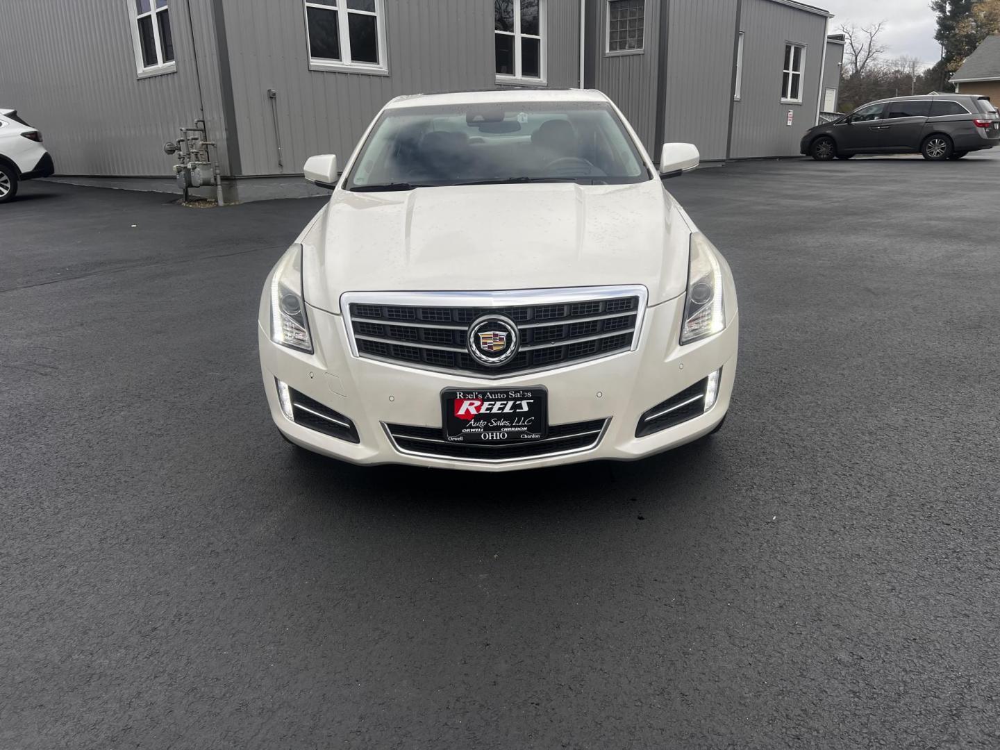 2014 White /Black Cadillac ATS 3.6L Premium AWD (1G6AL5S31E0) with an 3.6L V6 DOHC 24V engine, 6-Speed Automatic transmission, located at 11115 Chardon Rd. , Chardon, OH, 44024, (440) 214-9705, 41.580246, -81.241943 - This 2014 Cadillac ATS Premium V6 AWD is a luxury sedan that combines performance and comfort features. It comes with a robust 3.6-liter V6 engine producing 321 horsepower and is paired with a 6-speed automatic transmission, allowing for a brisk 0-60 mph time of 5.4 seconds. The interior is well-app - Photo#1