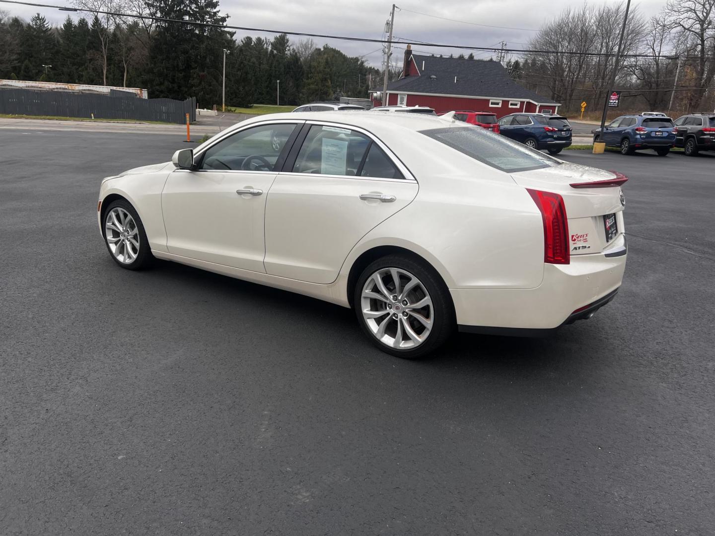 2014 White /Black Cadillac ATS 3.6L Premium AWD (1G6AL5S31E0) with an 3.6L V6 DOHC 24V engine, 6-Speed Automatic transmission, located at 11115 Chardon Rd. , Chardon, OH, 44024, (440) 214-9705, 41.580246, -81.241943 - This 2014 Cadillac ATS Premium V6 AWD is a luxury sedan that combines performance and comfort features. It comes with a robust 3.6-liter V6 engine producing 321 horsepower and is paired with a 6-speed automatic transmission, allowing for a brisk 0-60 mph time of 5.4 seconds. The interior is well-app - Photo#10