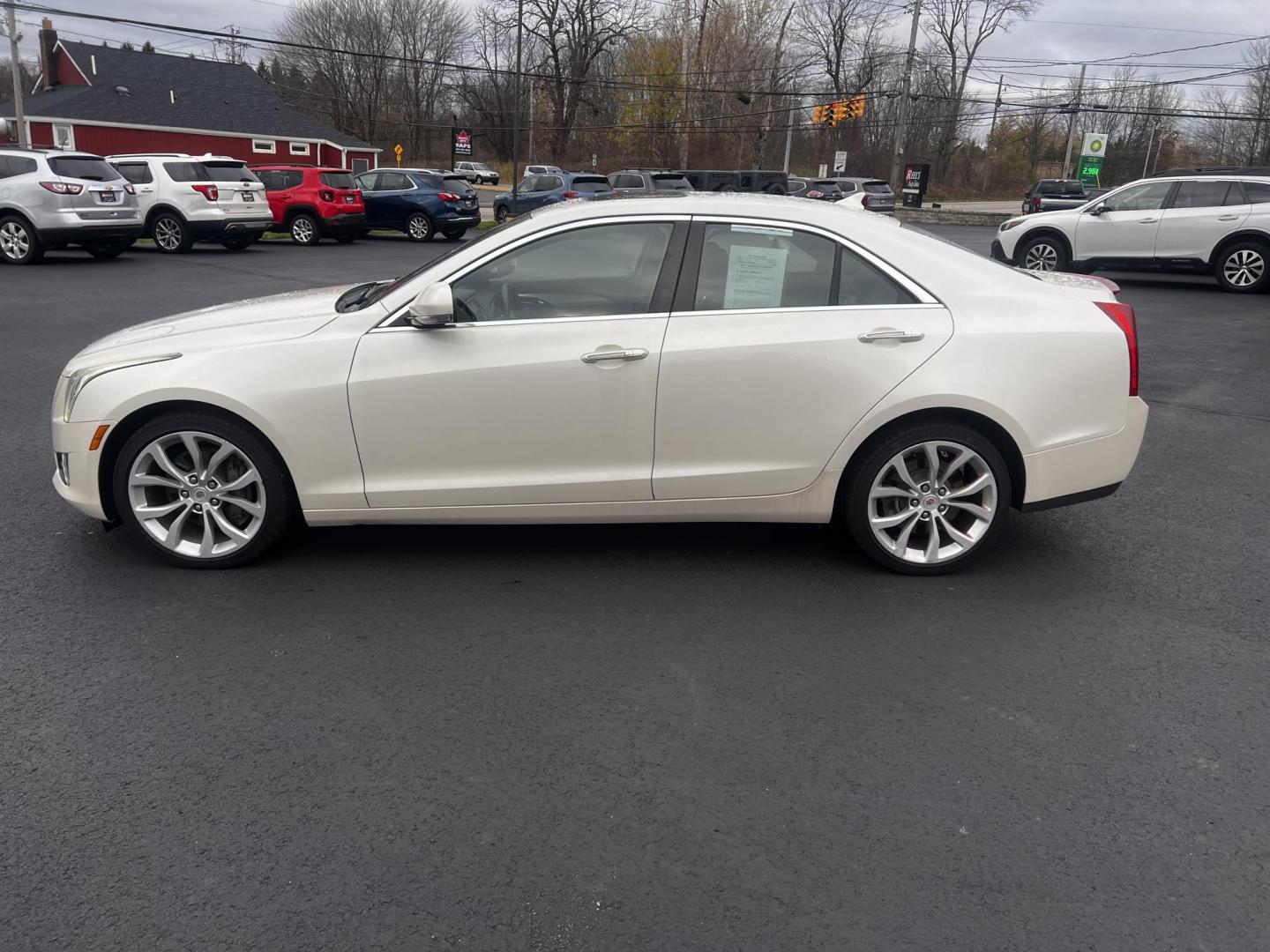 2014 White /Black Cadillac ATS 3.6L Premium AWD (1G6AL5S31E0) with an 3.6L V6 DOHC 24V engine, 6-Speed Automatic transmission, located at 11115 Chardon Rd. , Chardon, OH, 44024, (440) 214-9705, 41.580246, -81.241943 - This 2014 Cadillac ATS Premium V6 AWD is a luxury sedan that combines performance and comfort features. It comes with a robust 3.6-liter V6 engine producing 321 horsepower and is paired with a 6-speed automatic transmission, allowing for a brisk 0-60 mph time of 5.4 seconds. The interior is well-app - Photo#12