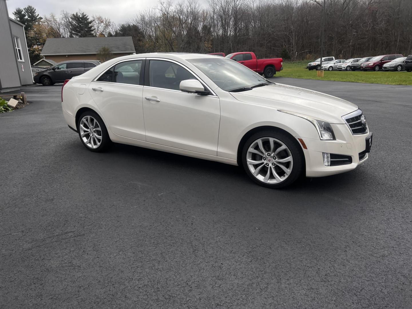 2014 White /Black Cadillac ATS 3.6L Premium AWD (1G6AL5S31E0) with an 3.6L V6 DOHC 24V engine, 6-Speed Automatic transmission, located at 11115 Chardon Rd. , Chardon, OH, 44024, (440) 214-9705, 41.580246, -81.241943 - This 2014 Cadillac ATS Premium V6 AWD is a luxury sedan that combines performance and comfort features. It comes with a robust 3.6-liter V6 engine producing 321 horsepower and is paired with a 6-speed automatic transmission, allowing for a brisk 0-60 mph time of 5.4 seconds. The interior is well-app - Photo#4