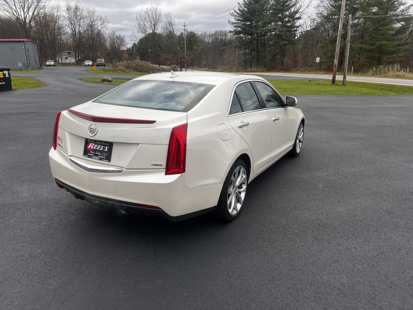 2014 White /Black Cadillac ATS 3.6L Premium AWD (1G6AL5S31E0) with an 3.6L V6 DOHC 24V engine, 6-Speed Automatic transmission, located at 11115 Chardon Rd. , Chardon, OH, 44024, (440) 214-9705, 41.580246, -81.241943 - This 2014 Cadillac ATS Premium V6 AWD is a luxury sedan that combines performance and comfort features. It comes with a robust 3.6-liter V6 engine producing 321 horsepower and is paired with a 6-speed automatic transmission, allowing for a brisk 0-60 mph time of 5.4 seconds. The interior is well-app - Photo#7