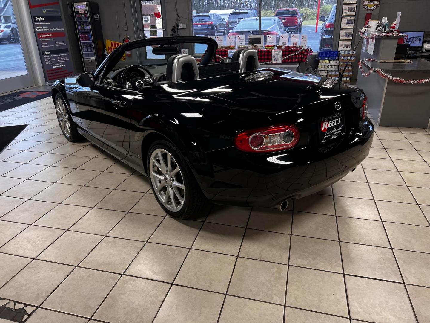 2012 Black /Black Mazda MX-5 Miata Grand Touring (JM1NC2PFXC0) with an 2.0L I4 DOHC 16V engine, 6 Speed Automatic transmission, located at 547 E. Main St., Orwell, OH, 44076, (440) 437-5893, 41.535435, -80.847855 - This 2012 Mazda MX-5 Miata Grand Touring with a hardtop features a 2.0-liter inline-four engine paired with a 6-speed automatic transmission, making it a stylish and sporty option for roadster enthusiasts. It comes equipped with HID headlights that enhance visibility and a premium leather interior g - Photo#10