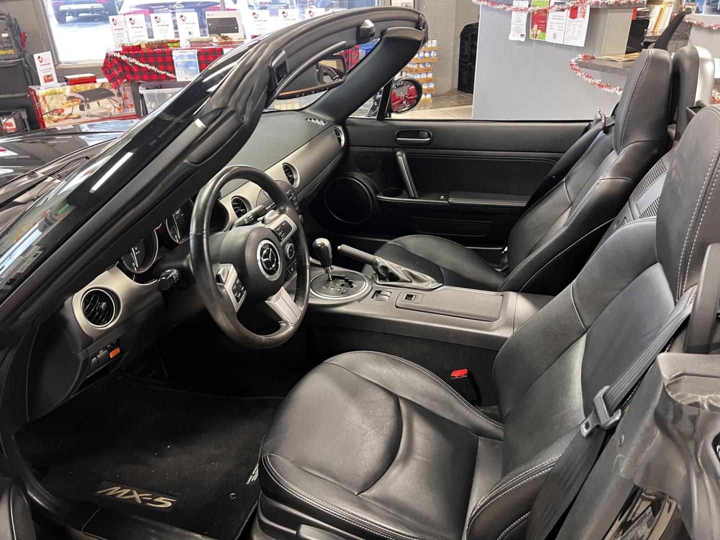 2012 Black /Black Mazda MX-5 Miata Grand Touring (JM1NC2PFXC0) with an 2.0L I4 DOHC 16V engine, 6 Speed Automatic transmission, located at 547 E. Main St., Orwell, OH, 44076, (440) 437-5893, 41.535435, -80.847855 - This 2012 Mazda MX-5 Miata Grand Touring with a hardtop features a 2.0-liter inline-four engine paired with a 6-speed automatic transmission, making it a stylish and sporty option for roadster enthusiasts. It comes equipped with HID headlights that enhance visibility and a premium leather interior g - Photo#15