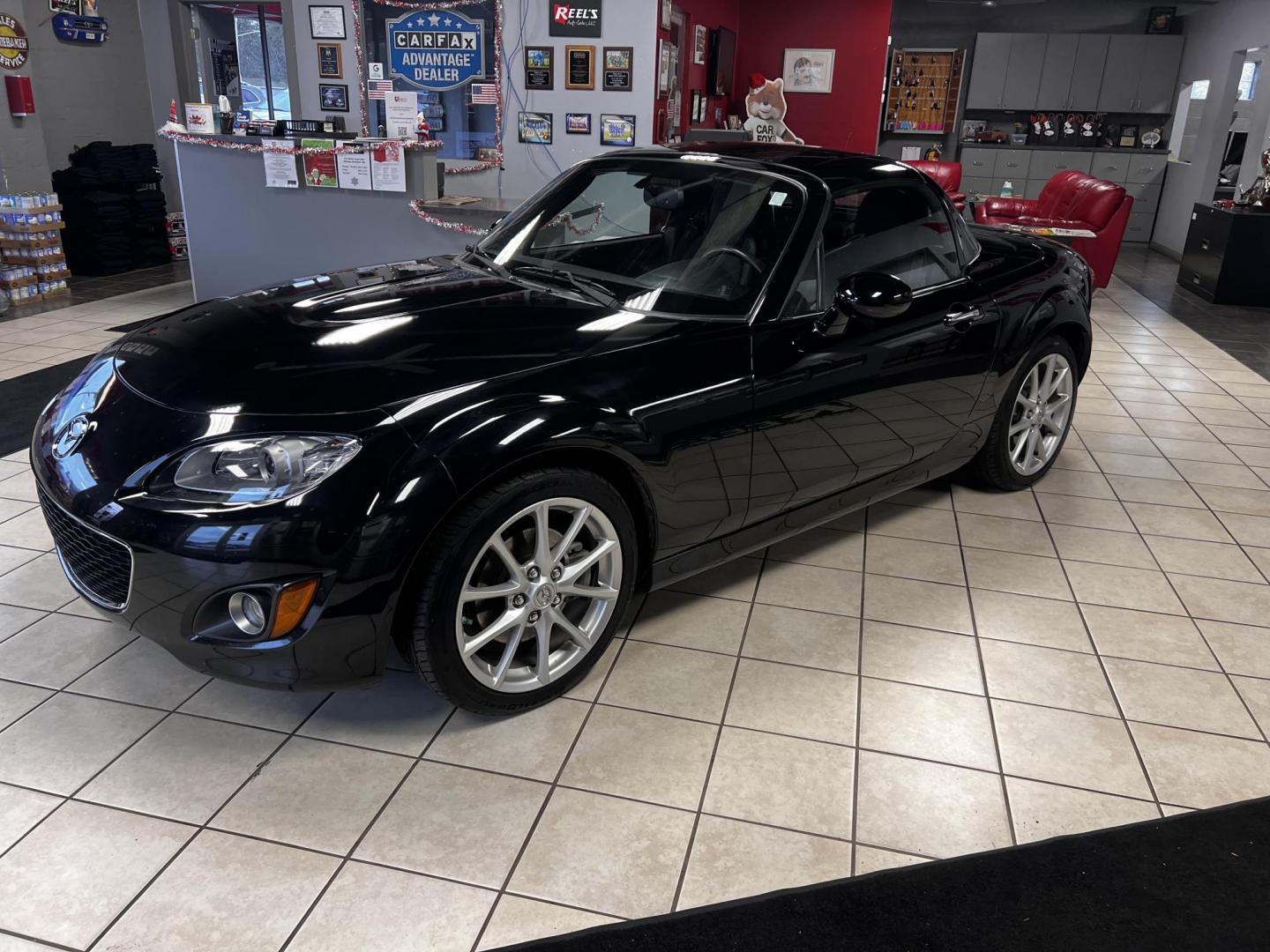 2012 Black /Black Mazda MX-5 Miata Grand Touring (JM1NC2PFXC0) with an 2.0L I4 DOHC 16V engine, 6 Speed Automatic transmission, located at 547 E. Main St., Orwell, OH, 44076, (440) 437-5893, 41.535435, -80.847855 - This 2012 Mazda MX-5 Miata Grand Touring with a hardtop features a 2.0-liter inline-four engine paired with a 6-speed automatic transmission, making it a stylish and sporty option for roadster enthusiasts. It comes equipped with HID headlights that enhance visibility and a premium leather interior g - Photo#30