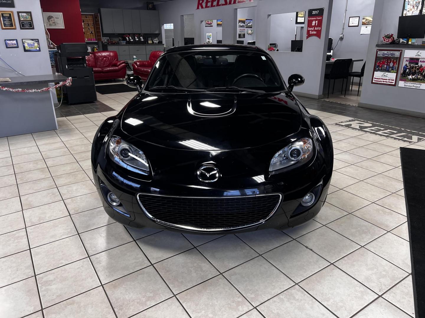 2012 Black /Black Mazda MX-5 Miata Grand Touring (JM1NC2PFXC0) with an 2.0L I4 DOHC 16V engine, 6 Speed Automatic transmission, located at 547 E. Main St., Orwell, OH, 44076, (440) 437-5893, 41.535435, -80.847855 - This 2012 Mazda MX-5 Miata Grand Touring with a hardtop features a 2.0-liter inline-four engine paired with a 6-speed automatic transmission, making it a stylish and sporty option for roadster enthusiasts. It comes equipped with HID headlights that enhance visibility and a premium leather interior g - Photo#31