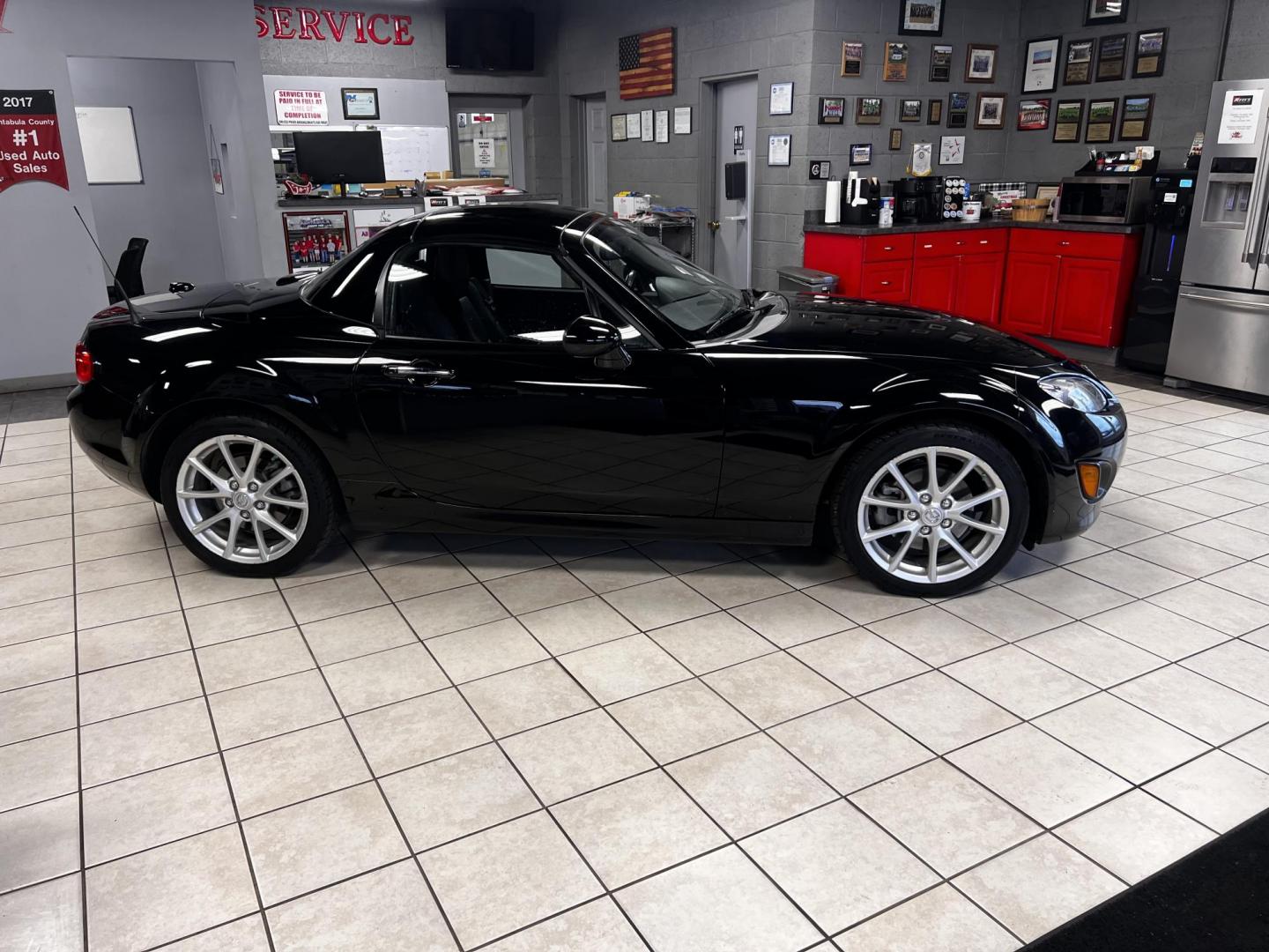 2012 Black /Black Mazda MX-5 Miata Grand Touring (JM1NC2PFXC0) with an 2.0L I4 DOHC 16V engine, 6 Speed Automatic transmission, located at 547 E. Main St., Orwell, OH, 44076, (440) 437-5893, 41.535435, -80.847855 - This 2012 Mazda MX-5 Miata Grand Touring with a hardtop features a 2.0-liter inline-four engine paired with a 6-speed automatic transmission, making it a stylish and sporty option for roadster enthusiasts. It comes equipped with HID headlights that enhance visibility and a premium leather interior g - Photo#32