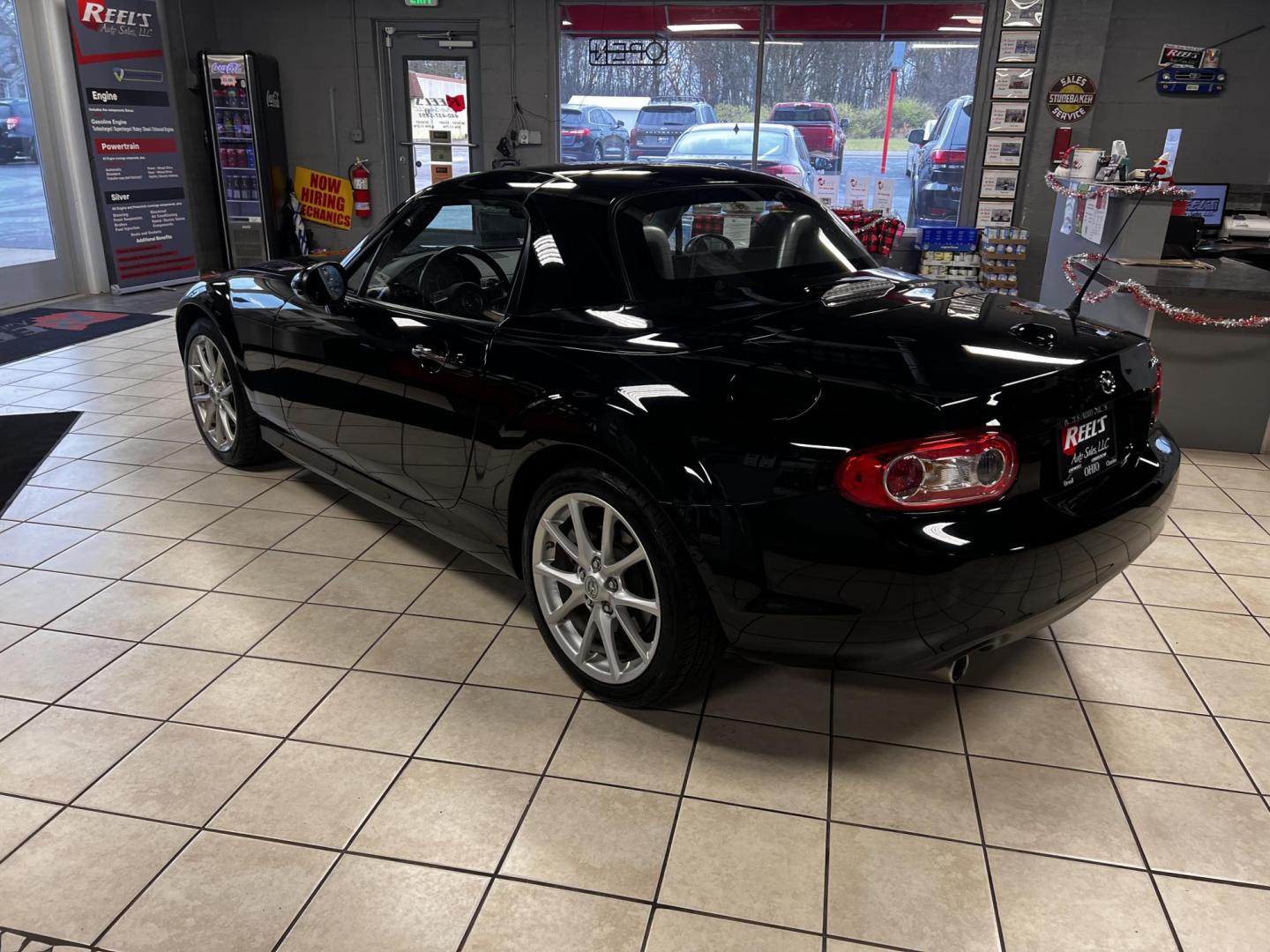 2012 Black /Black Mazda MX-5 Miata Grand Touring (JM1NC2PFXC0) with an 2.0L I4 DOHC 16V engine, 6 Speed Automatic transmission, located at 547 E. Main St., Orwell, OH, 44076, (440) 437-5893, 41.535435, -80.847855 - This 2012 Mazda MX-5 Miata Grand Touring with a hardtop features a 2.0-liter inline-four engine paired with a 6-speed automatic transmission, making it a stylish and sporty option for roadster enthusiasts. It comes equipped with HID headlights that enhance visibility and a premium leather interior g - Photo#35