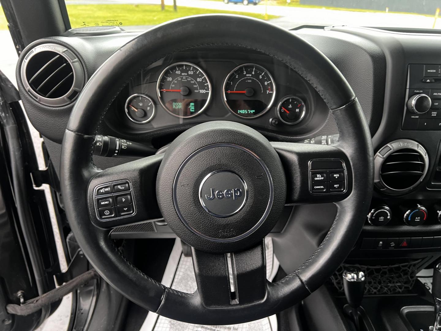 2015 Jeep Wrangler Unlimited Sport 4WD (1C4BJWDG6FL) with an 3.6L V6 DOHC 24V FFV engine, located at 547 E. Main St., Orwell, OH, 44076, (440) 437-5893, 41.535435, -80.847855 - This 2015 Jeep Wrangler Unlimited Sport is a versatile off-road vehicle powered by a 3.6-liter Pentastar V6 engine, known for its robust performance. It is equipped with a 5-speed automatic transmission that aids in seamless gear transitions. Notable for its off-road prowess, the Wrangler features a - Photo#20