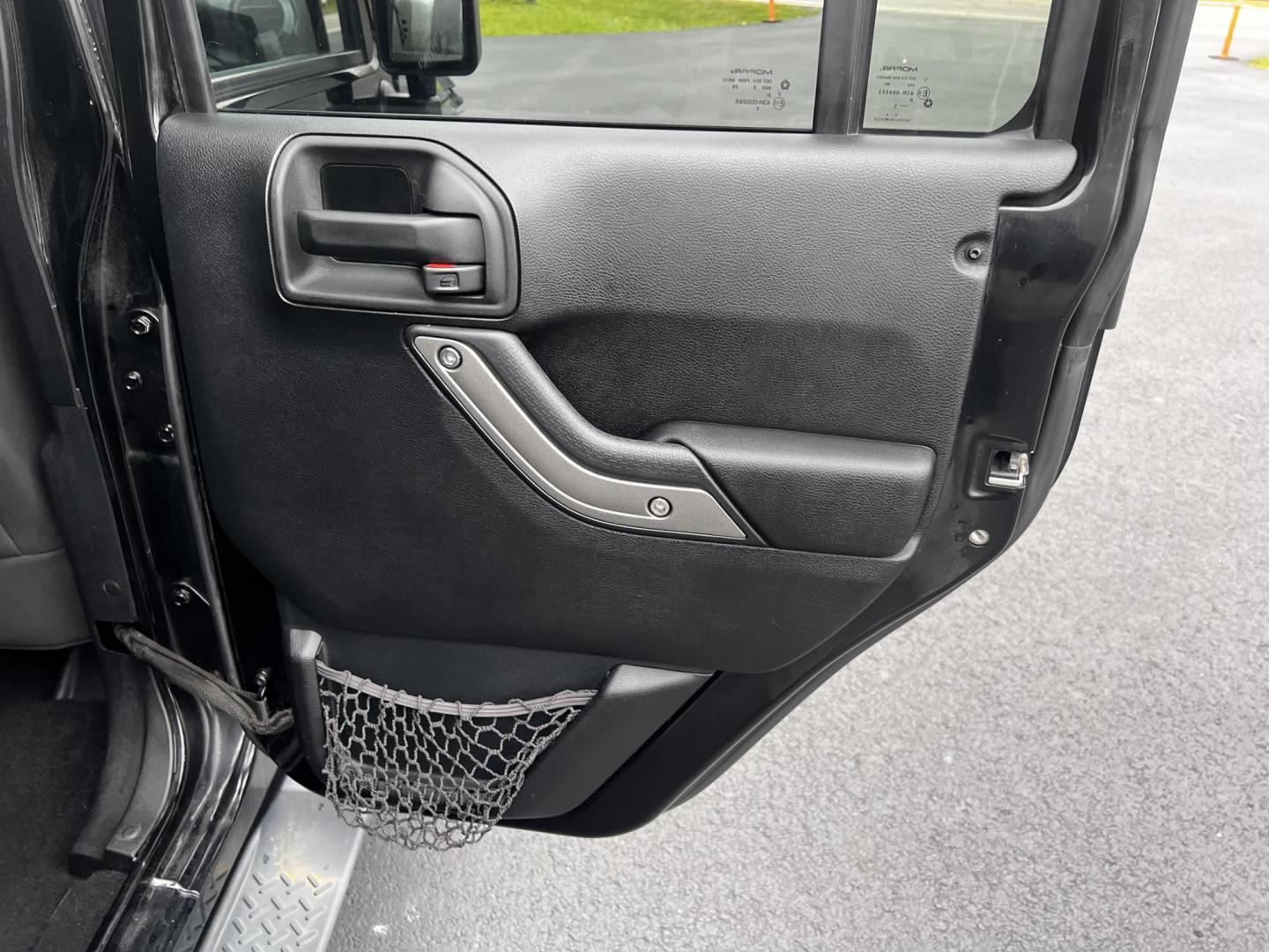 2015 Jeep Wrangler Unlimited Sport 4WD (1C4BJWDG6FL) with an 3.6L V6 DOHC 24V FFV engine, located at 547 E. Main St., Orwell, OH, 44076, (440) 437-5893, 41.535435, -80.847855 - This 2015 Jeep Wrangler Unlimited Sport is a versatile off-road vehicle powered by a 3.6-liter Pentastar V6 engine, known for its robust performance. It is equipped with a 5-speed automatic transmission that aids in seamless gear transitions. Notable for its off-road prowess, the Wrangler features a - Photo#32