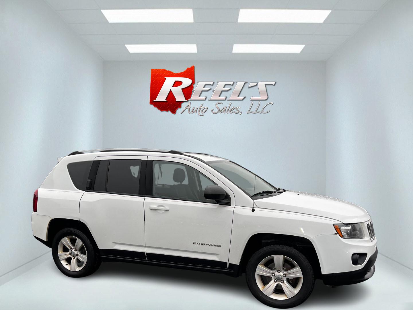 2016 White /Black Jeep Compass Sport 4WD (1C4NJDBB0GD) with an 2.4L I4 DOHC 16V engine, 6 Speed Auto transmission, located at 11115 Chardon Rd. , Chardon, OH, 44024, (440) 214-9705, 41.580246, -81.241943 - This 2016 Jeep Compass Sport 4WD is a compact SUV designed for versatility and efficiency, featuring a 2.4L I4 engine coupled with a 6-speed automatic transmission. It offers practical features such as an auto-dimming rearview mirror for reduced glare, dusk-sensing headlights for enhanced visibility - Photo#3