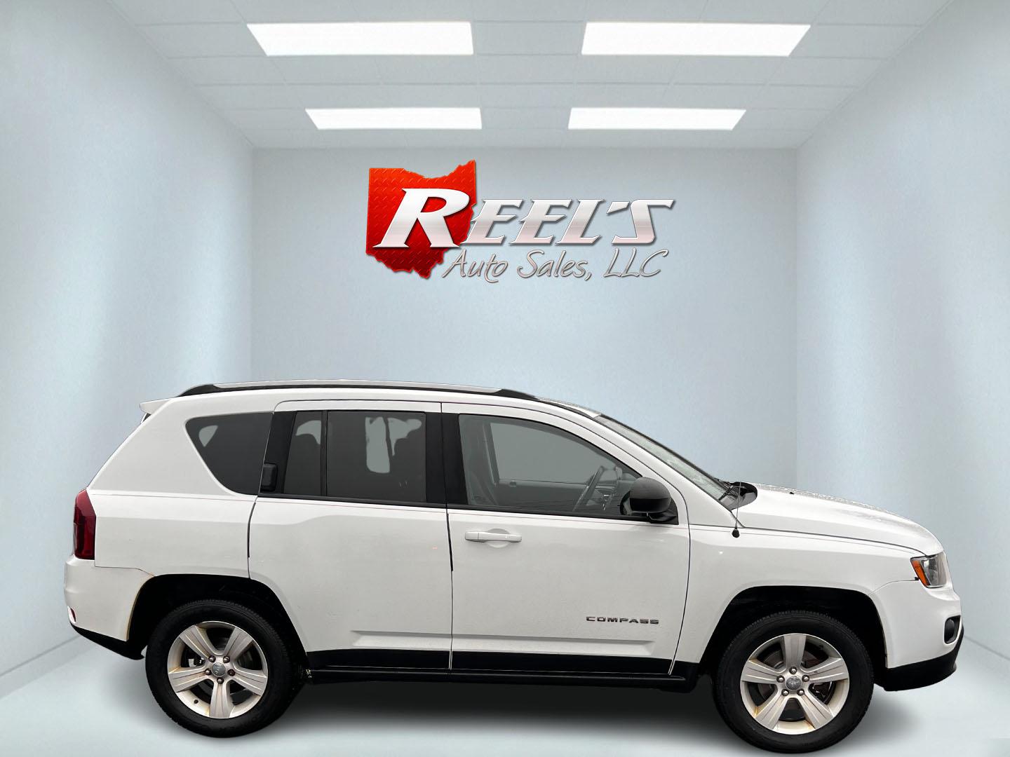 2016 White /Black Jeep Compass Sport 4WD (1C4NJDBB0GD) with an 2.4L I4 DOHC 16V engine, 6 Speed Auto transmission, located at 11115 Chardon Rd. , Chardon, OH, 44024, (440) 214-9705, 41.580246, -81.241943 - This 2016 Jeep Compass Sport 4WD is a compact SUV designed for versatility and efficiency, featuring a 2.4L I4 engine coupled with a 6-speed automatic transmission. It offers practical features such as an auto-dimming rearview mirror for reduced glare, dusk-sensing headlights for enhanced visibility - Photo#4