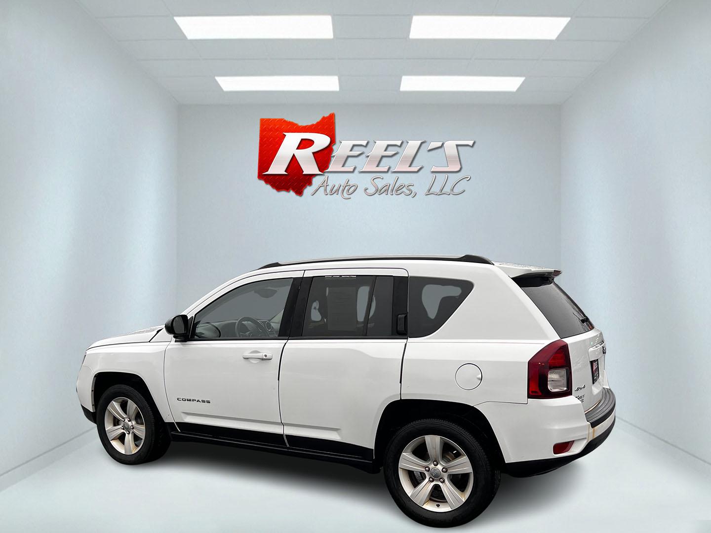 2016 White /Black Jeep Compass Sport 4WD (1C4NJDBB0GD) with an 2.4L I4 DOHC 16V engine, 6 Speed Auto transmission, located at 11115 Chardon Rd. , Chardon, OH, 44024, (440) 214-9705, 41.580246, -81.241943 - This 2016 Jeep Compass Sport 4WD is a compact SUV designed for versatility and efficiency, featuring a 2.4L I4 engine coupled with a 6-speed automatic transmission. It offers practical features such as an auto-dimming rearview mirror for reduced glare, dusk-sensing headlights for enhanced visibility - Photo#8