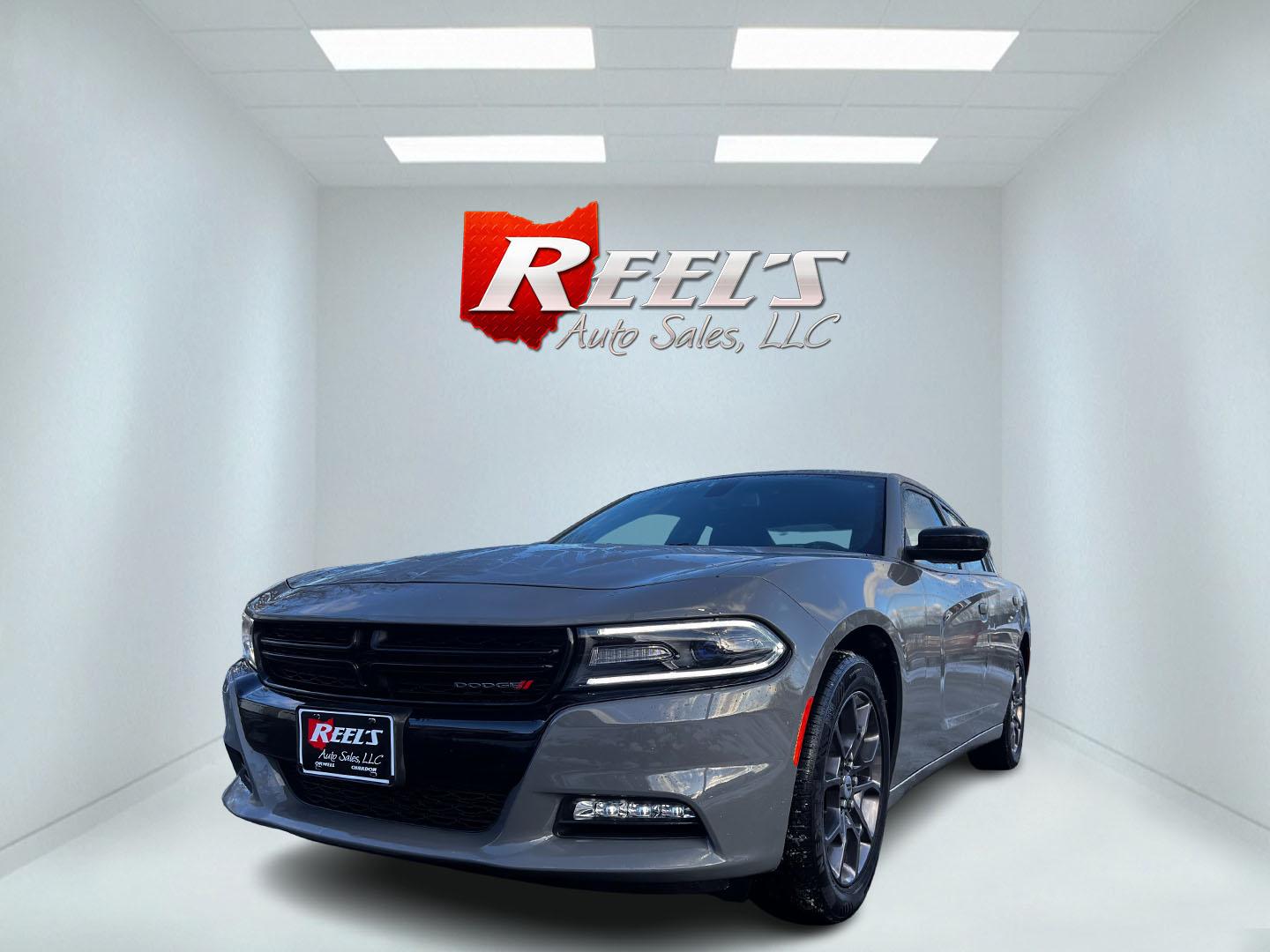 2018 Gray /Black Dodge Charger GT AWD (2C3CDXJG9JH) with an 3.6L V6 DOHC 24V engine, 8A transmission, located at 547 E. Main St., Orwell, OH, 44076, (440) 437-5893, 41.535435, -80.847855 - This One Owner 2018 Dodge Charger GT AWD is a high-performance sedan powered by a 3.6 Pentastar V6 engine yielding 300 HP and coupled with an 8-speed automatic transmission. The car can accelerate from 0-60 in an impressive 6.0 seconds, and offers efficiency with 27 MPG on the highway. The 8.4-inch - Photo#0