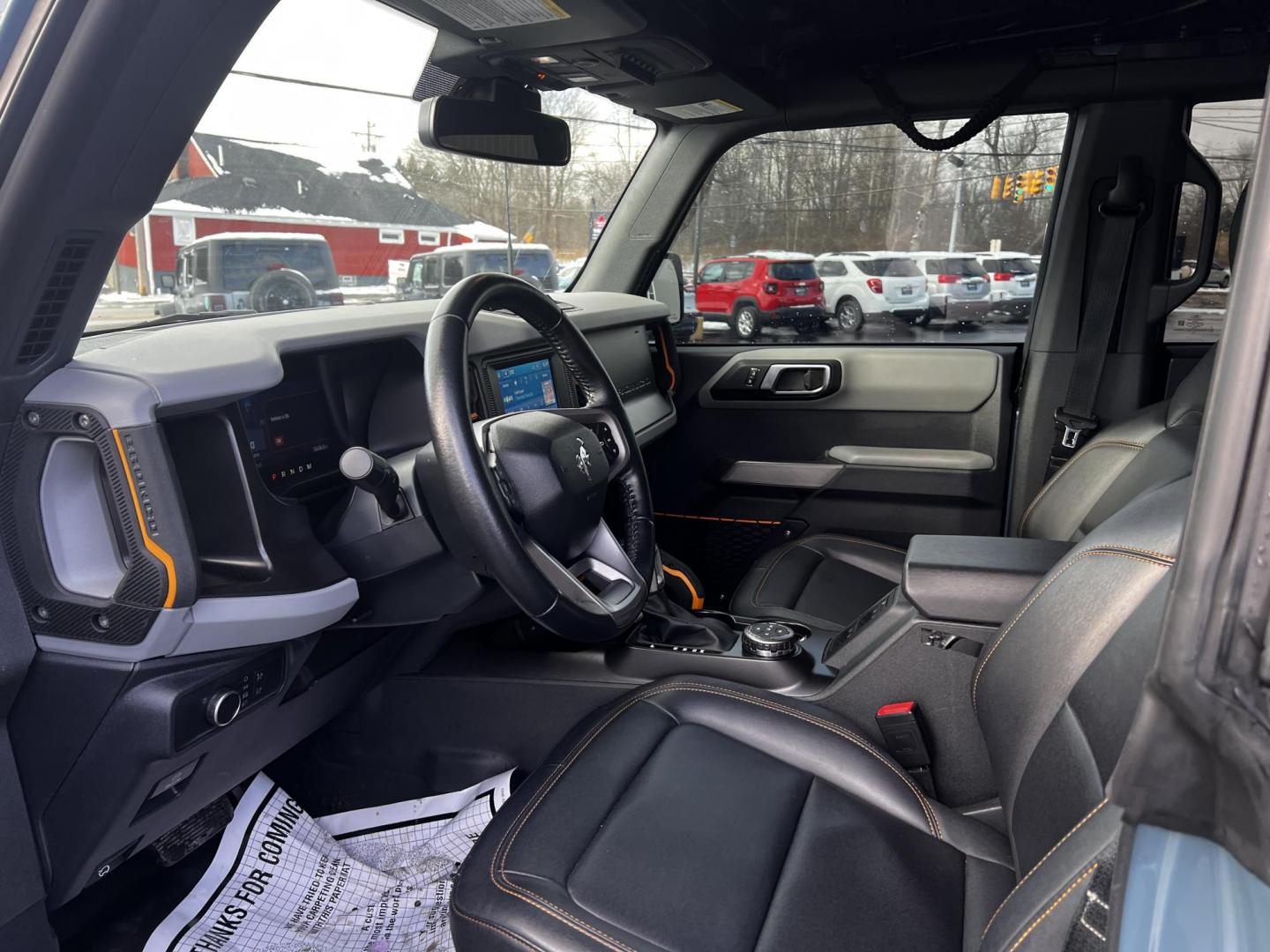 2022 Blue /Black Ford Bronco Badlands 4-Door (1FMEE5DP6NL) with an 2.7L V6 DOHC 24V TWIN TURBO engine, 10 Speed Auto transmission, located at 11115 Chardon Rd. , Chardon, OH, 44024, (440) 214-9705, 41.580246, -81.241943 - This 2022 Ford Bronco Badlands, equipped with a robust 2.7L Twin Turbo EcoBoost V6 engine, delivers an impressive 330 horsepower and 415 lb-ft of torque, making it a formidable choice for off-road enthusiasts. Its 10-speed automatic transmission ensures smooth and responsive performance, while 37" a - Photo#14