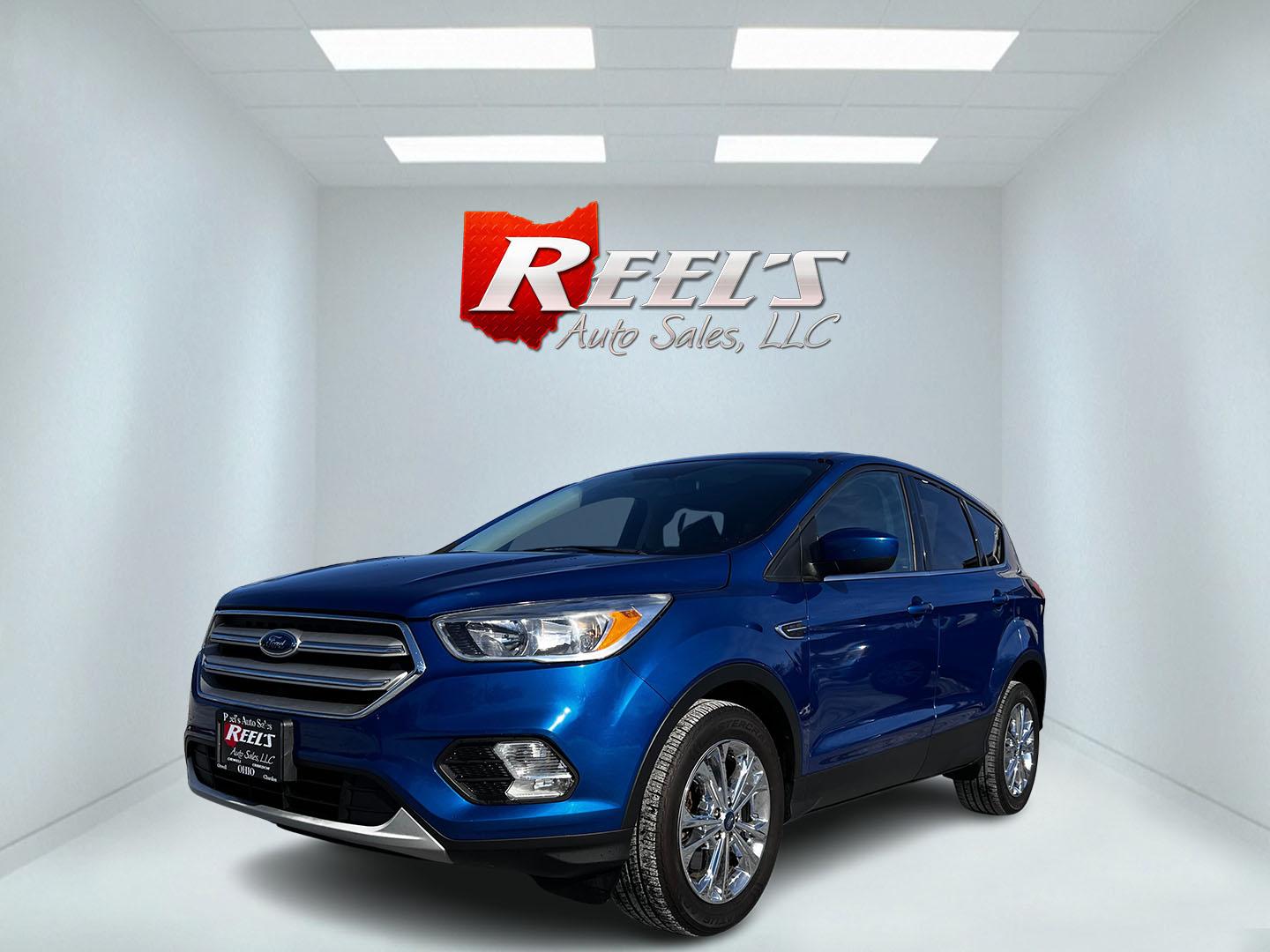 2019 Blue /Black Ford Escape SE 4WD (1FMCU9GD2KU) with an 1.5L I4 DOHC 16V TURBO engine, 6A transmission, located at 11115 Chardon Rd. , Chardon, OH, 44024, (440) 214-9705, 41.580246, -81.241943 - This One Owner 2019 Ford Escape SE 4WD is a well-equipped compact SUV that combines efficiency, comfort, and modern technology. It features a 1.5-liter turbocharged I4 EcoBoost engine paired with a 6-speed automatic transmission, delivering robust performance while achieving 28 MPG on the highway. C - Photo#0