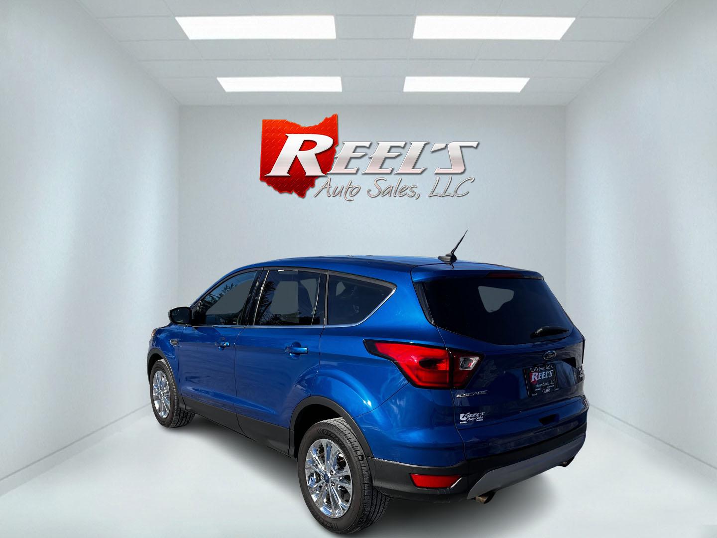 2019 Blue /Black Ford Escape SE 4WD (1FMCU9GD2KU) with an 1.5L I4 DOHC 16V TURBO engine, 6A transmission, located at 11115 Chardon Rd. , Chardon, OH, 44024, (440) 214-9705, 41.580246, -81.241943 - This One Owner 2019 Ford Escape SE 4WD is a well-equipped compact SUV that combines efficiency, comfort, and modern technology. It features a 1.5-liter turbocharged I4 EcoBoost engine paired with a 6-speed automatic transmission, delivering robust performance while achieving 28 MPG on the highway. C - Photo#7