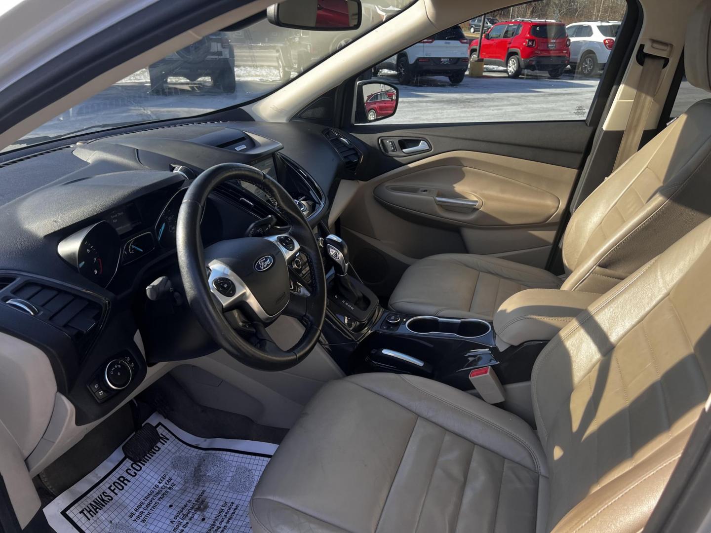 2016 White /Gray Ford Escape Titanium 4WD (1FMCU9J93GU) with an 2.0L I4 DOHC 16V Turbo engine, 6-Speed Automatic transmission, located at 547 E. Main St., Orwell, OH, 44076, (440) 437-5893, 41.535435, -80.847855 - This 2016 Ford Escape Titanium 4WD is a sophisticated and versatile compact SUV that excels in both performance and comfort. It is powered by a robust 2.0-liter turbocharged I4 EcoBoost engine linked to a 6-speed automatic transmission, providing impressive power and a towing capacity of up to 3,500 - Photo#15