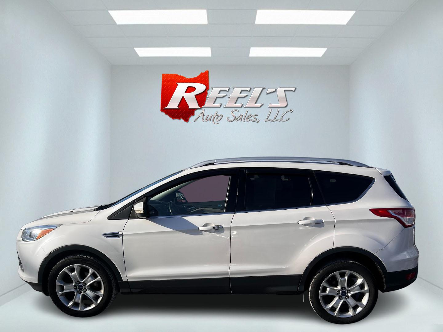 2016 White /Gray Ford Escape Titanium 4WD (1FMCU9J93GU) with an 2.0L I4 DOHC 16V Turbo engine, 6-Speed Automatic transmission, located at 547 E. Main St., Orwell, OH, 44076, (440) 437-5893, 41.535435, -80.847855 - This 2016 Ford Escape Titanium 4WD is a sophisticated and versatile compact SUV that excels in both performance and comfort. It is powered by a robust 2.0-liter turbocharged I4 EcoBoost engine linked to a 6-speed automatic transmission, providing impressive power and a towing capacity of up to 3,500 - Photo#9