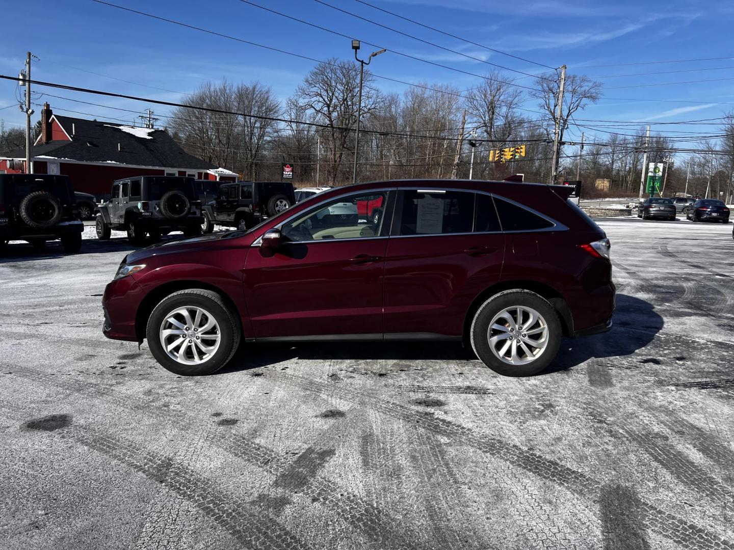 2017 Red /Tan Acura RDX 6-Spd AT AWD w/ Technology Package (5J8TB4H5XHL) with an 3.5L V6 SOHC 24V engine, 6 Speed Auto transmission, located at 11115 Chardon Rd. , Chardon, OH, 44024, (440) 214-9705, 41.580246, -81.241943 - This One Owner 2017 Acura RDX AWD is a luxury compact SUV that combines performance, comfort, and advanced technology. Equipped with a 3.5-liter V6 engine and a 6-speed automatic transmission, it achieves a 0-60 mph time of 6.5 seconds, offering a spirited driving experience. The interior features p - Photo#16