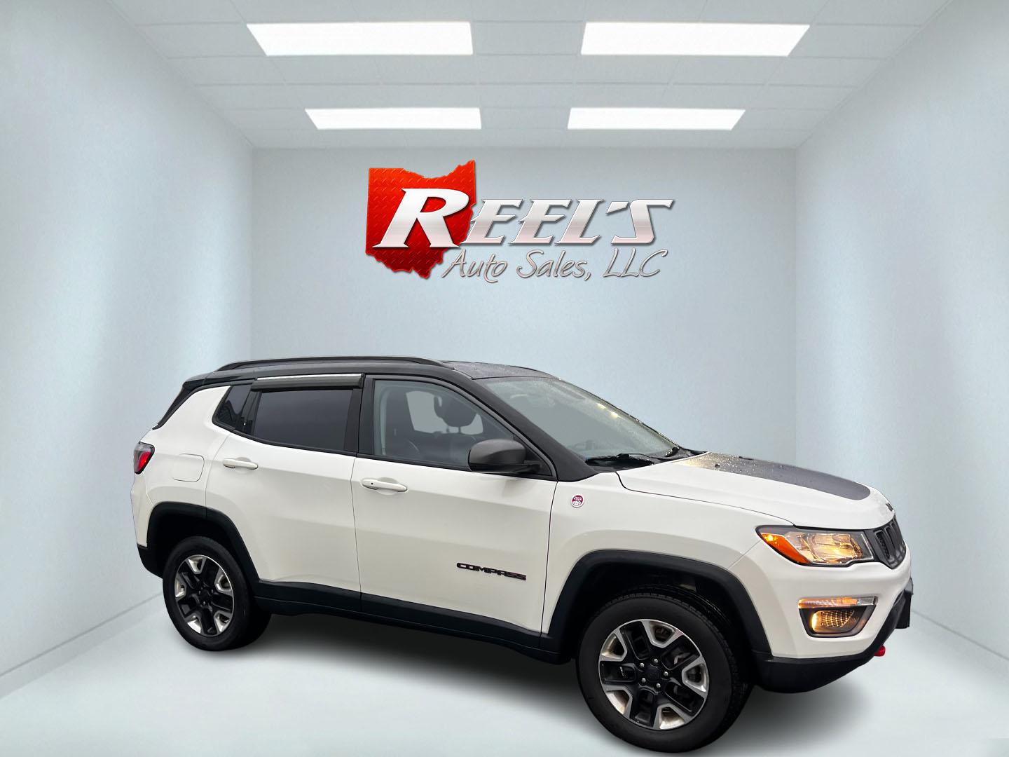 2018 White /Black Jeep Compass Trailhawk 4WD (3C4NJDDB3JT) with an 2.4L I4 DOHC 16V engine, 9 Speed Automatic transmission, located at 11115 Chardon Rd. , Chardon, OH, 44024, (440) 214-9705, 41.580246, -81.241943 - This 2018 Jeep Compass Trailhawk is designed for both rugged off-road adventures and comfortable daily driving. It is powered by a 2.4-liter I4 engine mated to a 9-speed automatic transmission, providing reliable performance and smooth gear transitions. This vehicle features an 8.4-inch touchscreen - Photo#3