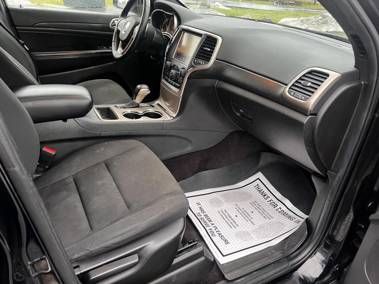 2017 Black /Black Jeep Grand Cherokee Laredo E 4WD (1C4RJFAG7HC) with an 3.6L V6 DOHC 24V engine, 8A transmission, located at 11115 Chardon Rd. , Chardon, OH, 44024, (440) 214-9705, 41.580246, -81.241943 - This 2017 Jeep Grand Cherokee Laredo E 4WD is a solid choice for those seeking a reliable and feature-rich SUV. It comes with a 3.6-liter V6 engine paired with an 8-speed automatic transmission, providing a smooth and capable driving experience. This SUV features a power driver's seat for personaliz - Photo#35