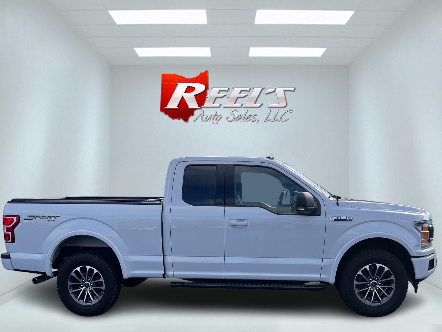 2019 White /Black Ford F-150 XLT SuperCab 6.5-ft. 4WD (1FTFX1E59KF) with an 5.0L V8 OHV 16V engine, 10 Speed Auto transmission, located at 11115 Chardon Rd. , Chardon, OH, 44024, (440) 214-9705, 41.580246, -81.241943 - This 2019 Ford F-150 XLT Supercab 4WD is a robust and versatile pickup truck ideal for both work and play. Equipped with a powerful 5.0-liter Coyote V8 engine, it delivers an impressive 395 horsepower and 400 lb-ft of torque, supporting a notable 9,100-pound towing capacity. Inside, it offers heated - Photo#4