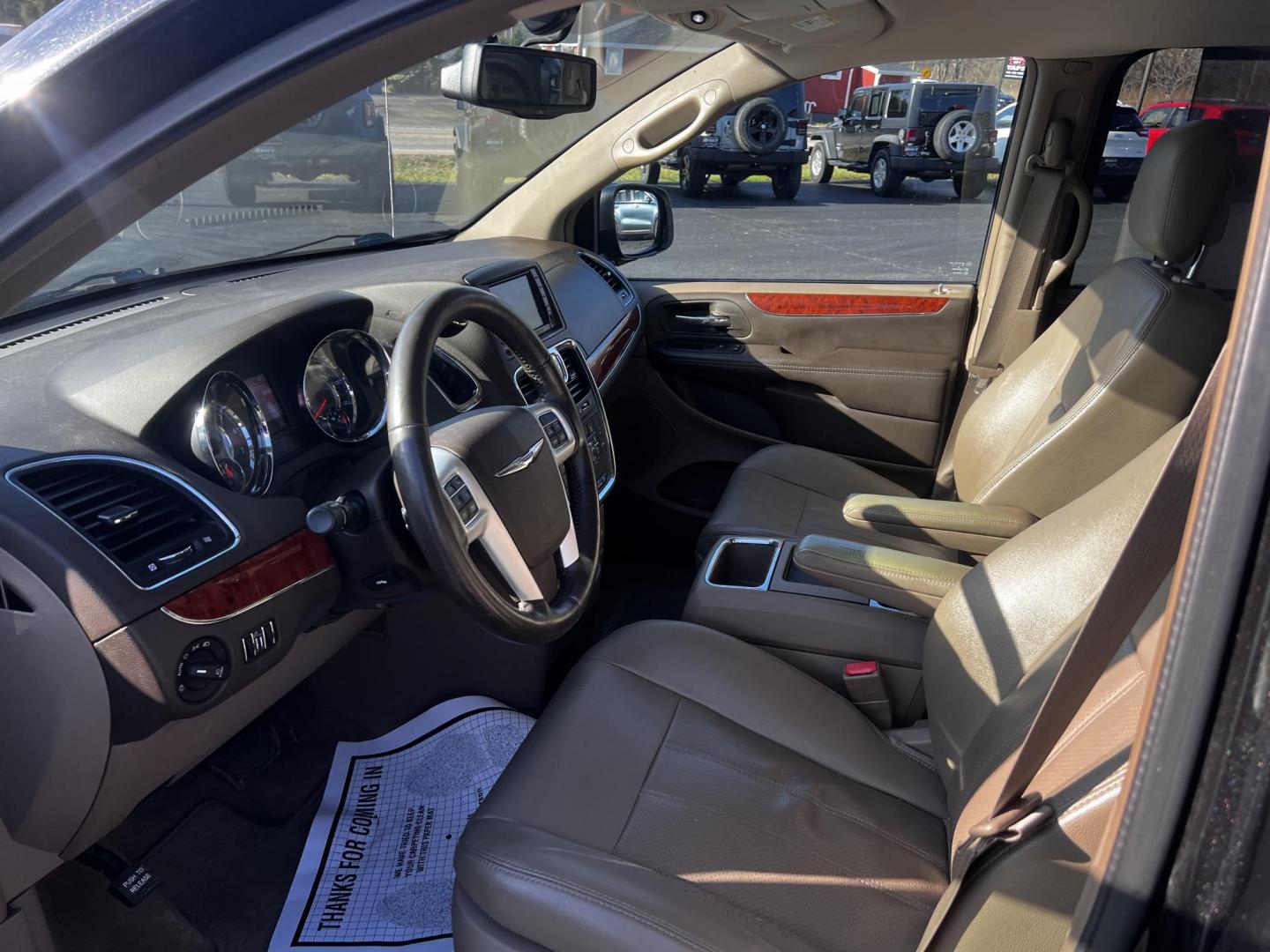 2014 Black /Brown Chrysler Town & Country Touring-L (2C4RC1CG2ER) with an 3.6L V6 DOHC 24V FFV engine, 6-Speed Automatic transmission, located at 11115 Chardon Rd. , Chardon, OH, 44024, (440) 214-9705, 41.580246, -81.241943 - This 2014 Chrysler Town & Country Touring-L is a versatile minivan designed for family comfort and convenience. It is powered by a 3.6-liter V6 engine, paired with a 6-speed automatic transmission, ensuring a smooth and reliable driving experience. Featuring a well-appointed leather interior, it off - Photo#14