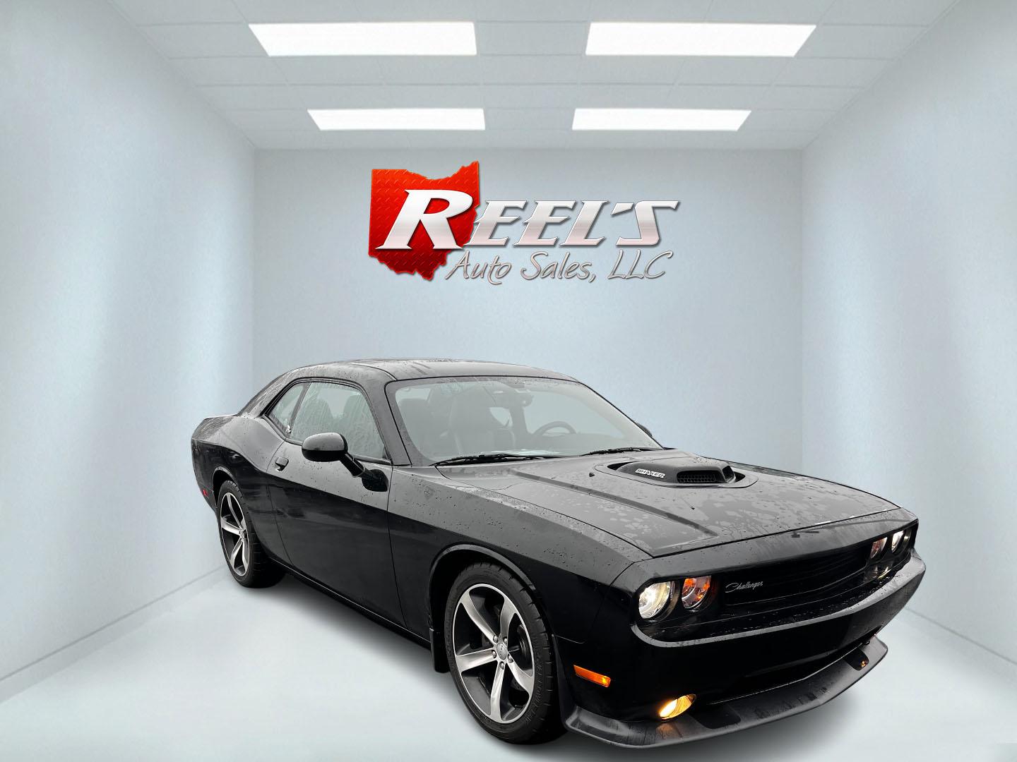 2014 Black /Black Dodge Challenger R/T Shacker (2C3CDYBT8EH) with an 5.7L V8 OHV 16V engine, 5 Speed Auto transmission, located at 547 E. Main St., Orwell, OH, 44076, (440) 437-5893, 41.535435, -80.847855 - This 2014 Dodge Challenger R/T Shaker is a powerful and stylish muscle car featuring a robust 5.7-liter HEMI V8 engine paired with a 5-speed automatic transmission. It delivers impressive performance with 372 horsepower and 400 lb-ft of torque, achieving 0-60 mph in about 5.5 seconds. This vehicle i - Photo#2