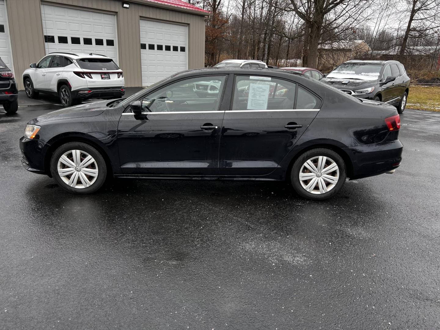 2017 Black /Gray Volkswagen Jetta 1.4T S 6A (3VW2B7AJ1HM) with an 1.4L I4 DOHC 20V Turbo engine, 6 Speed Automatic transmission, located at 547 E. Main St., Orwell, OH, 44076, (440) 437-5893, 41.535435, -80.847855 - Photo#12