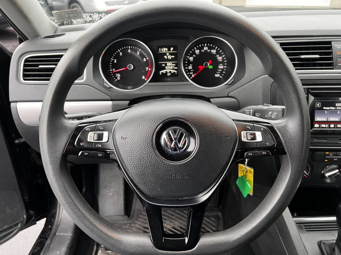 2017 Black /Gray Volkswagen Jetta 1.4T S 6A (3VW2B7AJ1HM) with an 1.4L I4 DOHC 20V Turbo engine, 6 Speed Automatic transmission, located at 547 E. Main St., Orwell, OH, 44076, (440) 437-5893, 41.535435, -80.847855 - This 2017 Volkswagen Jetta S is a compact sedan powered by a 1.4L turbocharged I4 engine, combined with a 6-speed automatic transmission, offering a commendable 38 MPG on the highway. It features LED daytime running lights and LED tail lights for enhanced visibility and modern styling. Inside, this - Photo#23