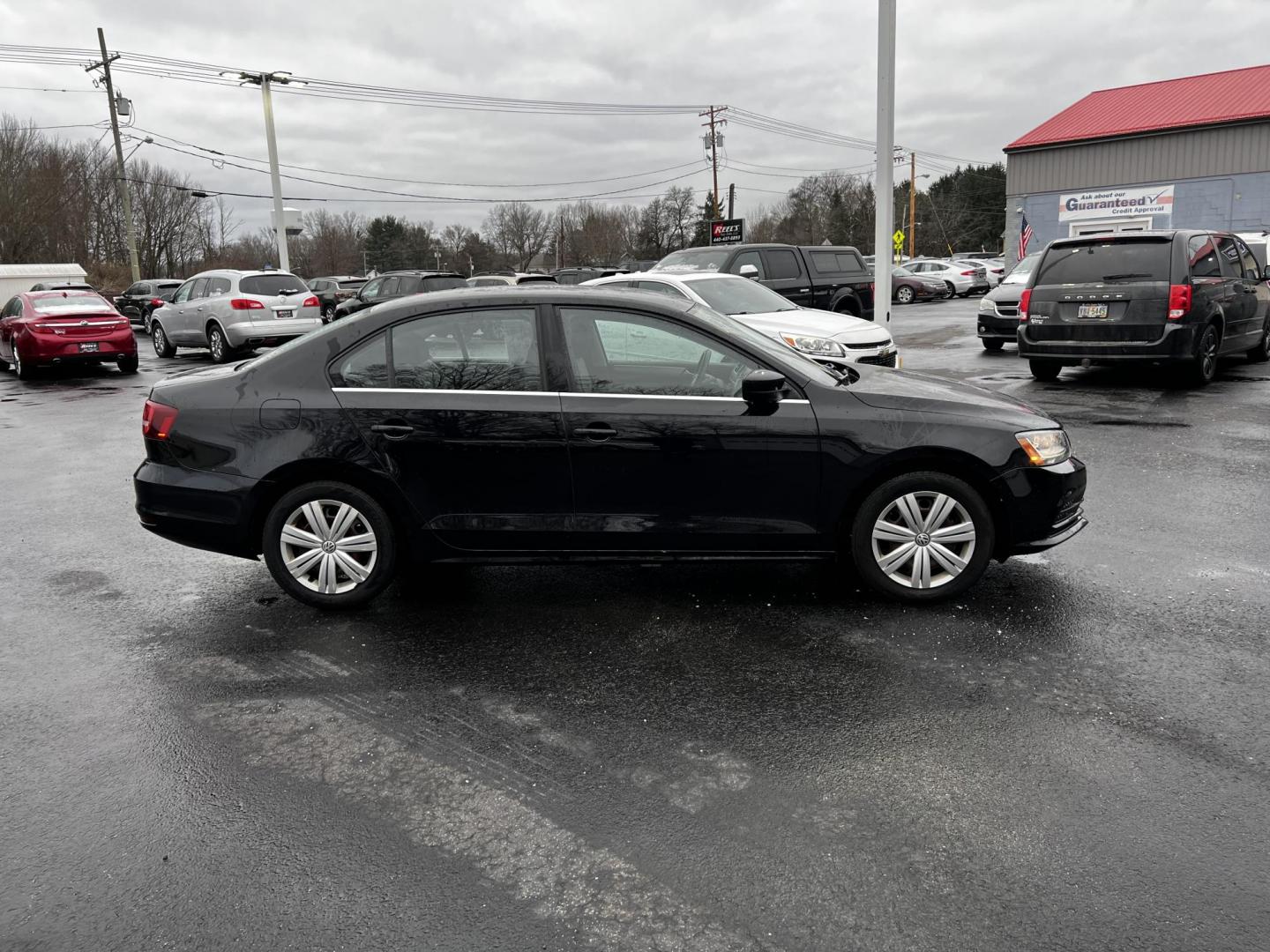 2017 Black /Gray Volkswagen Jetta 1.4T S 6A (3VW2B7AJ1HM) with an 1.4L I4 DOHC 20V Turbo engine, 6 Speed Automatic transmission, located at 547 E. Main St., Orwell, OH, 44076, (440) 437-5893, 41.535435, -80.847855 - Photo#4