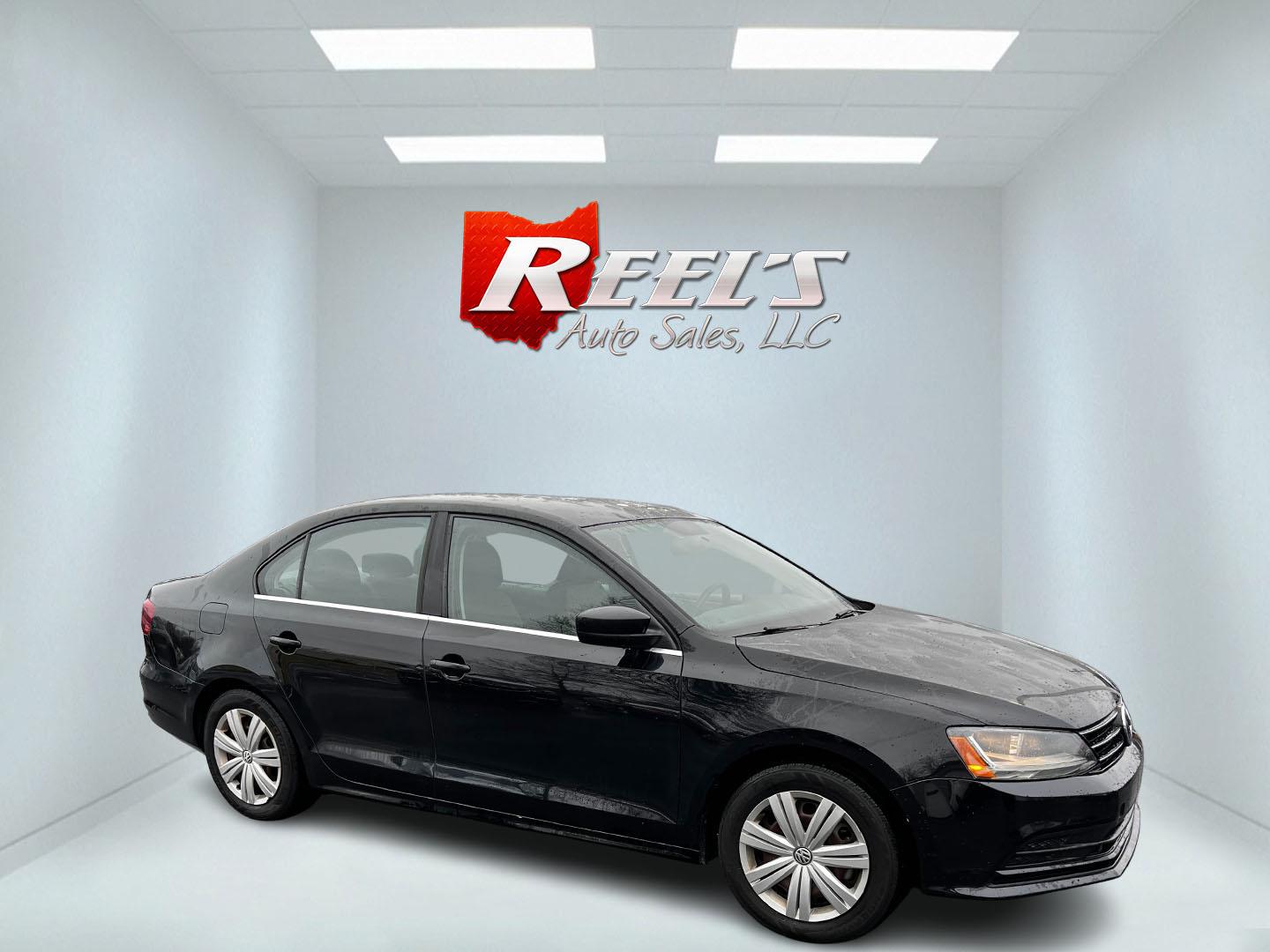 2017 Black /Gray Volkswagen Jetta 1.4T S 6A (3VW2B7AJ1HM) with an 1.4L I4 DOHC 20V Turbo engine, 6 Speed Automatic transmission, located at 547 E. Main St., Orwell, OH, 44076, (440) 437-5893, 41.535435, -80.847855 - This 2017 Volkswagen Jetta S is a compact sedan powered by a 1.4L turbocharged I4 engine, combined with a 6-speed automatic transmission, offering a commendable 38 MPG on the highway. It features LED daytime running lights and LED tail lights for enhanced visibility and modern styling. Inside, this - Photo#3