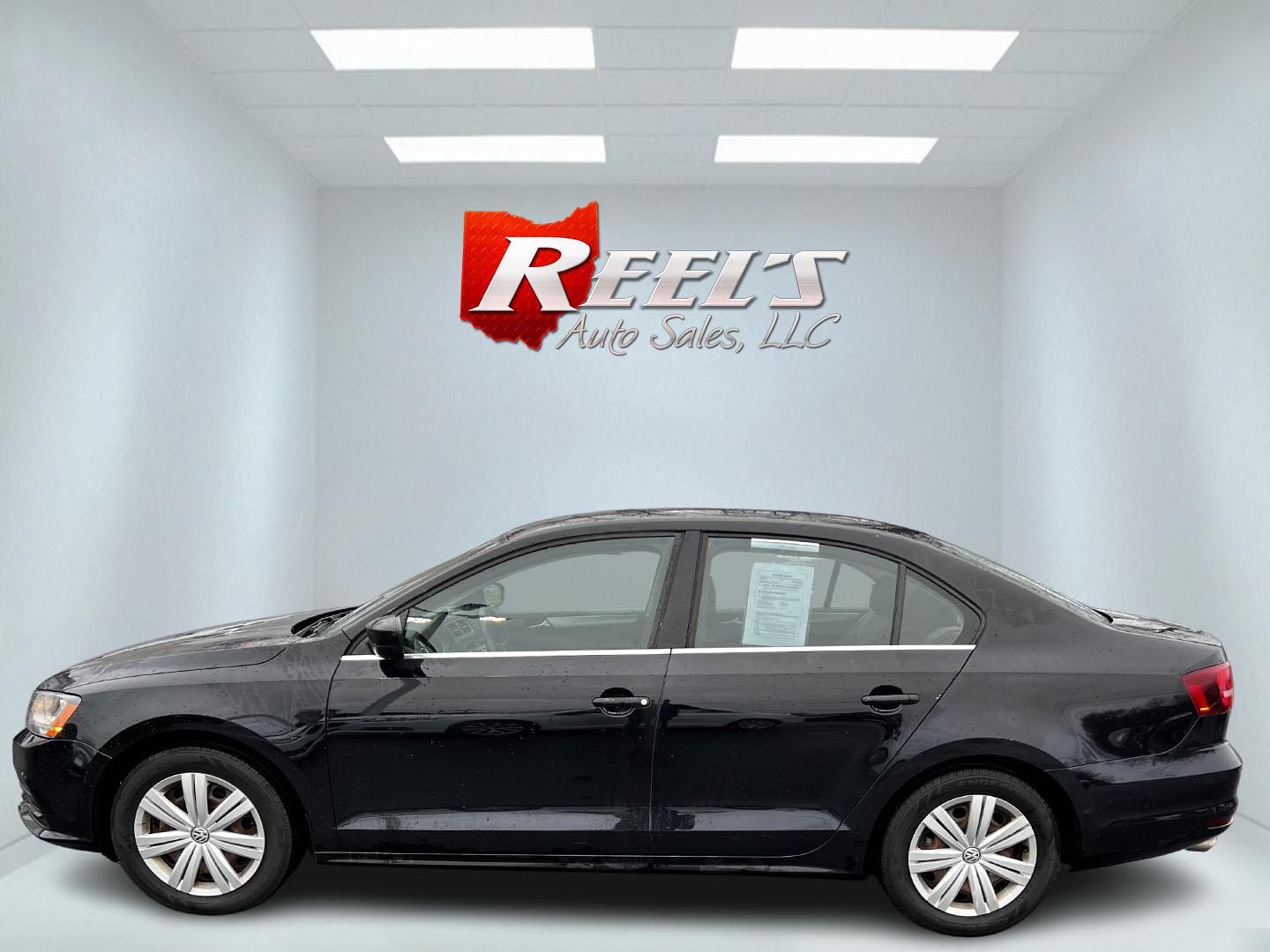 2017 Black /Gray Volkswagen Jetta 1.4T S 6A (3VW2B7AJ1HM) with an 1.4L I4 DOHC 20V Turbo engine, 6 Speed Automatic transmission, located at 547 E. Main St., Orwell, OH, 44076, (440) 437-5893, 41.535435, -80.847855 - This 2017 Volkswagen Jetta S is a compact sedan powered by a 1.4L turbocharged I4 engine, combined with a 6-speed automatic transmission, offering a commendable 38 MPG on the highway. It features LED daytime running lights and LED tail lights for enhanced visibility and modern styling. Inside, this - Photo#9