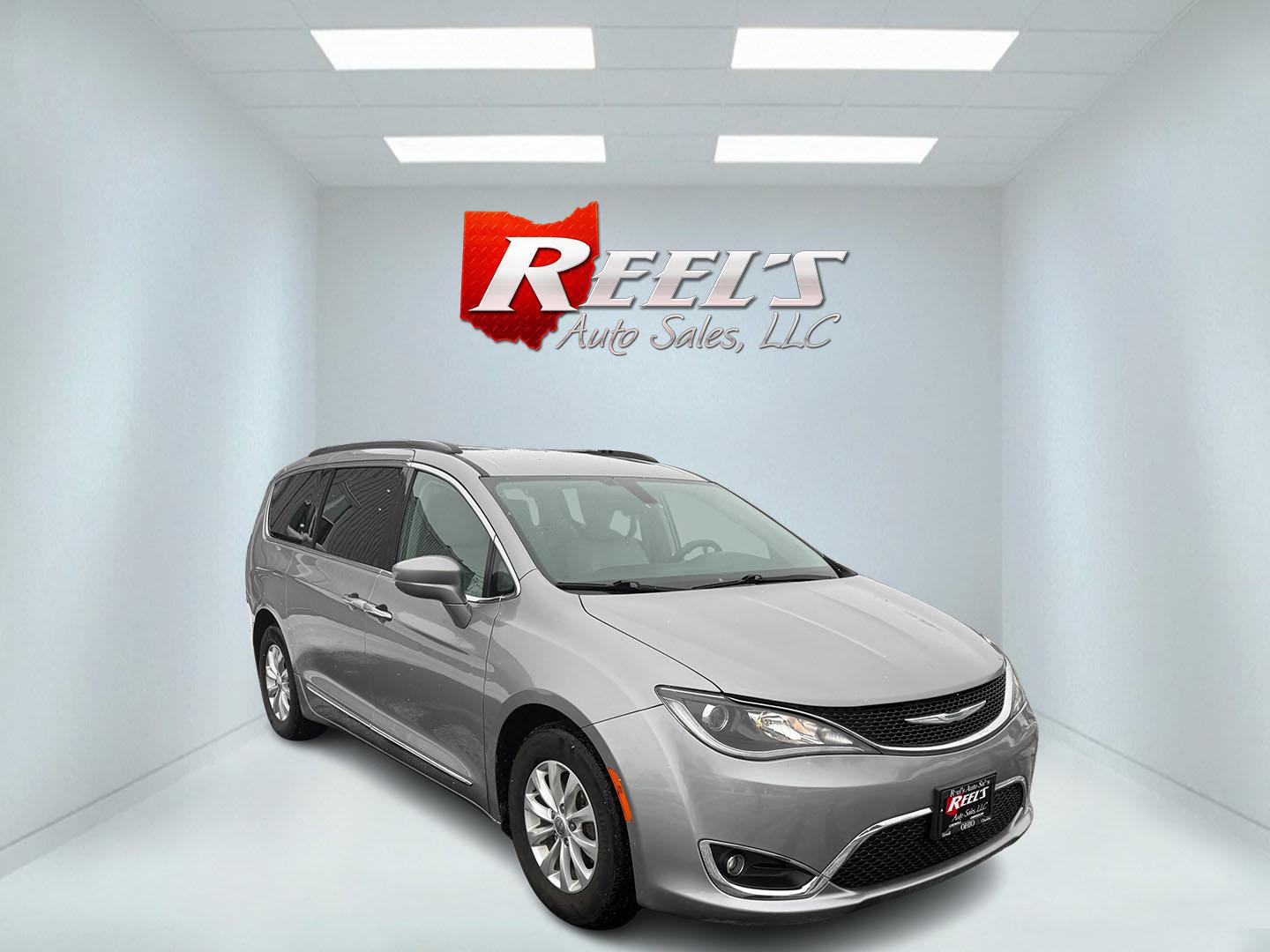 2017 Silver /White Chrysler Pacifica Touring-L (2C4RC1BG3HR) with an 3.6L V6 DOHC 24V engine, 9 Speed Automatic transmission, located at 11115 Chardon Rd. , Chardon, OH, 44024, (440) 214-9705, 41.580246, -81.241943 - This 2017 Chrysler Pacifica Touring-L is a versatile minivan that combines efficiency, comfort, and modern features, making it an ideal choice for families. Powered by a 3.6-liter Pentastar V6 engine paired with a 9-speed automatic transmission, it offers a comfortable ride with an impressive highwa - Photo#2