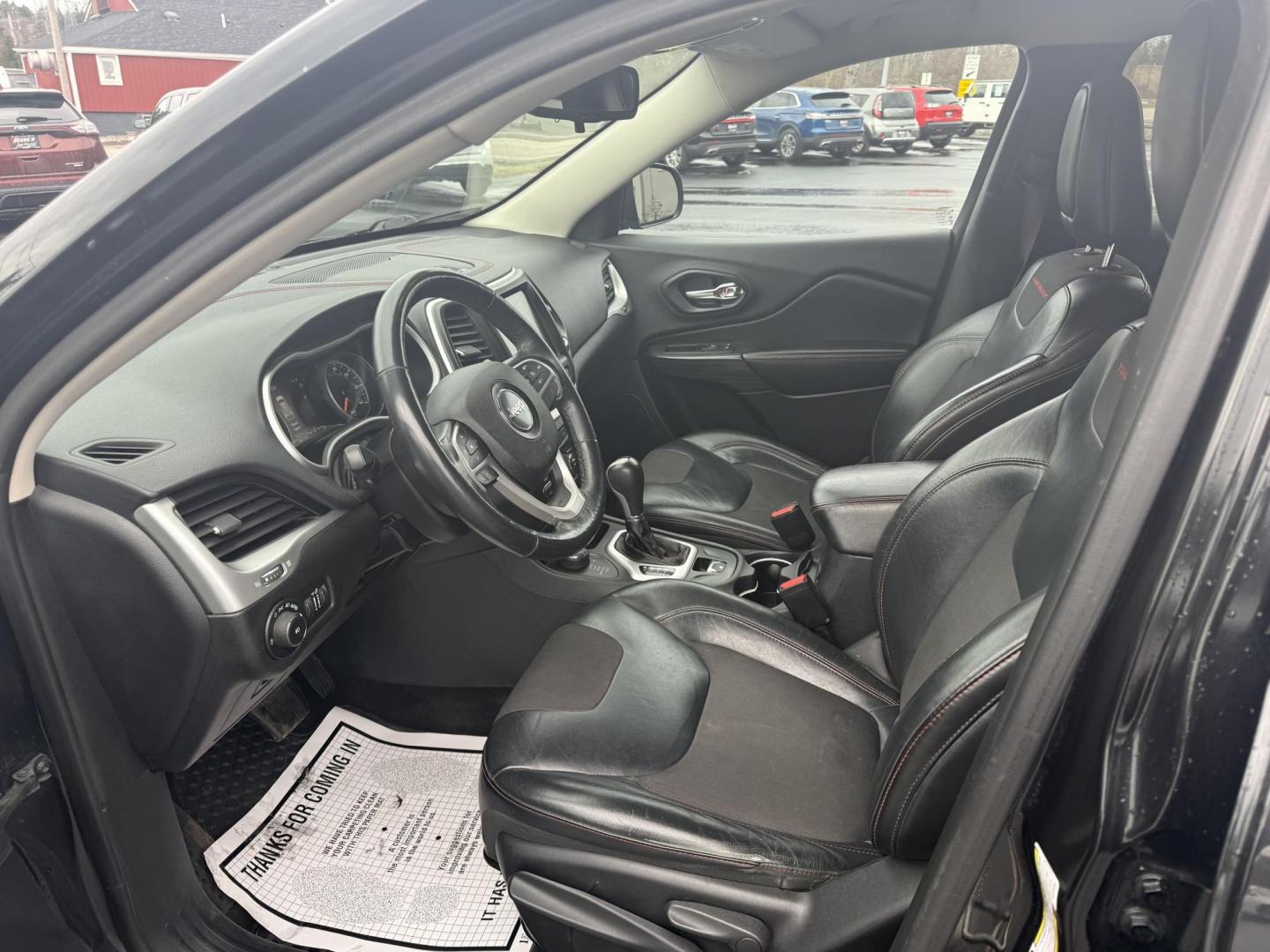 2015 Black /Black Jeep Cherokee Trailhawk 4WD (1C4PJMBB4FW) with an 2.4L I4 DOHC 16V engine, 9-Speed Automatic transmission, located at 11115 Chardon Rd. , Chardon, OH, 44024, (440) 214-9705, 41.580246, -81.241943 - This 2015 Jeep Cherokee Trailhawk is a robust choice for off-road enthusiasts, featuring a 2.4L I4 engine and a sophisticated Active Drive Lock system with a locking rear differential, ensuring enhanced off-road traction and performance. Its Trail Rated capability, coupled with 8.7 inches of ground - Photo#4