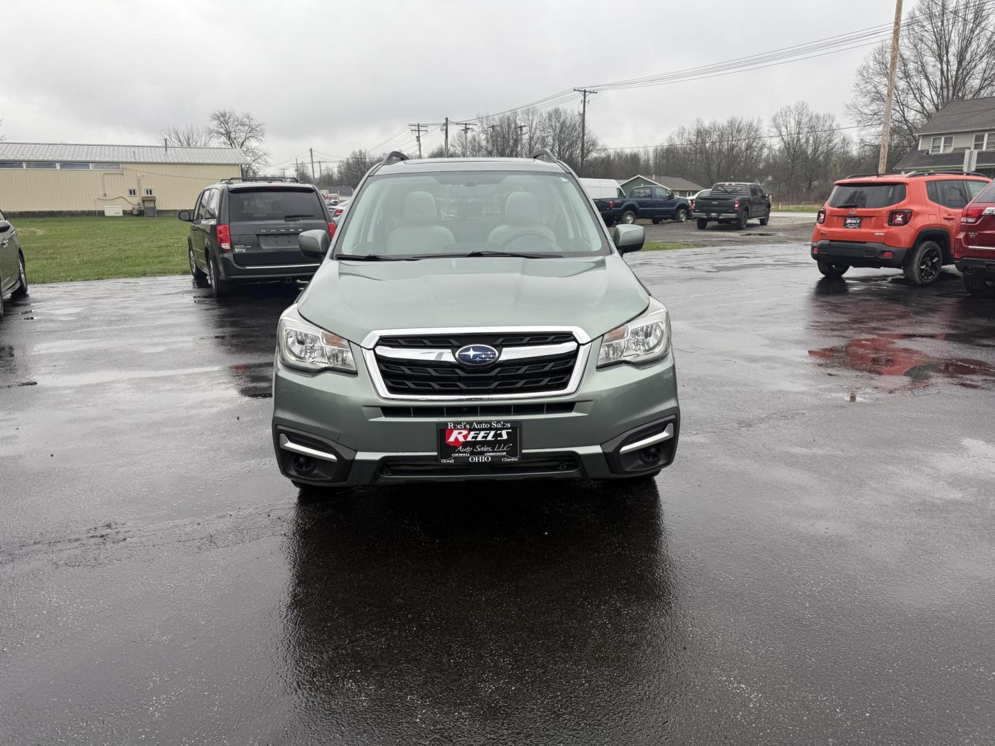 2017 Green /Gray Subaru Forester 2.5i Premium PZEV CVT (JF2SJAEC3HH) with an 2.5L H4 DOHC 16V engine, Automatic transmission, located at 547 E. Main St., Orwell, OH, 44076, (440) 437-5893, 41.535435, -80.847855 - This One Owner Subaru Forester is super fuel efficient and capable. With a 2.5-liter H4 engine and Subaru's Symmetrical All-Wheel Drive system, offering stability and traction. It features comforts like heated front seats, a 7.0-inch touchscreen for infotainment, and single-zone automatic climate co - Photo#1